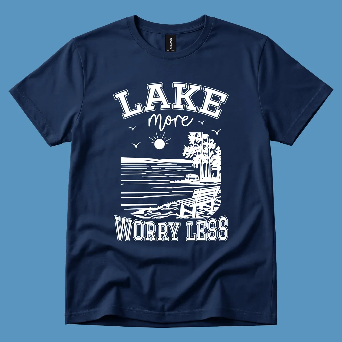 Lake More Worry Less scenic illustration with lake, trees, bench, and sun, white text on black, navy text on white.