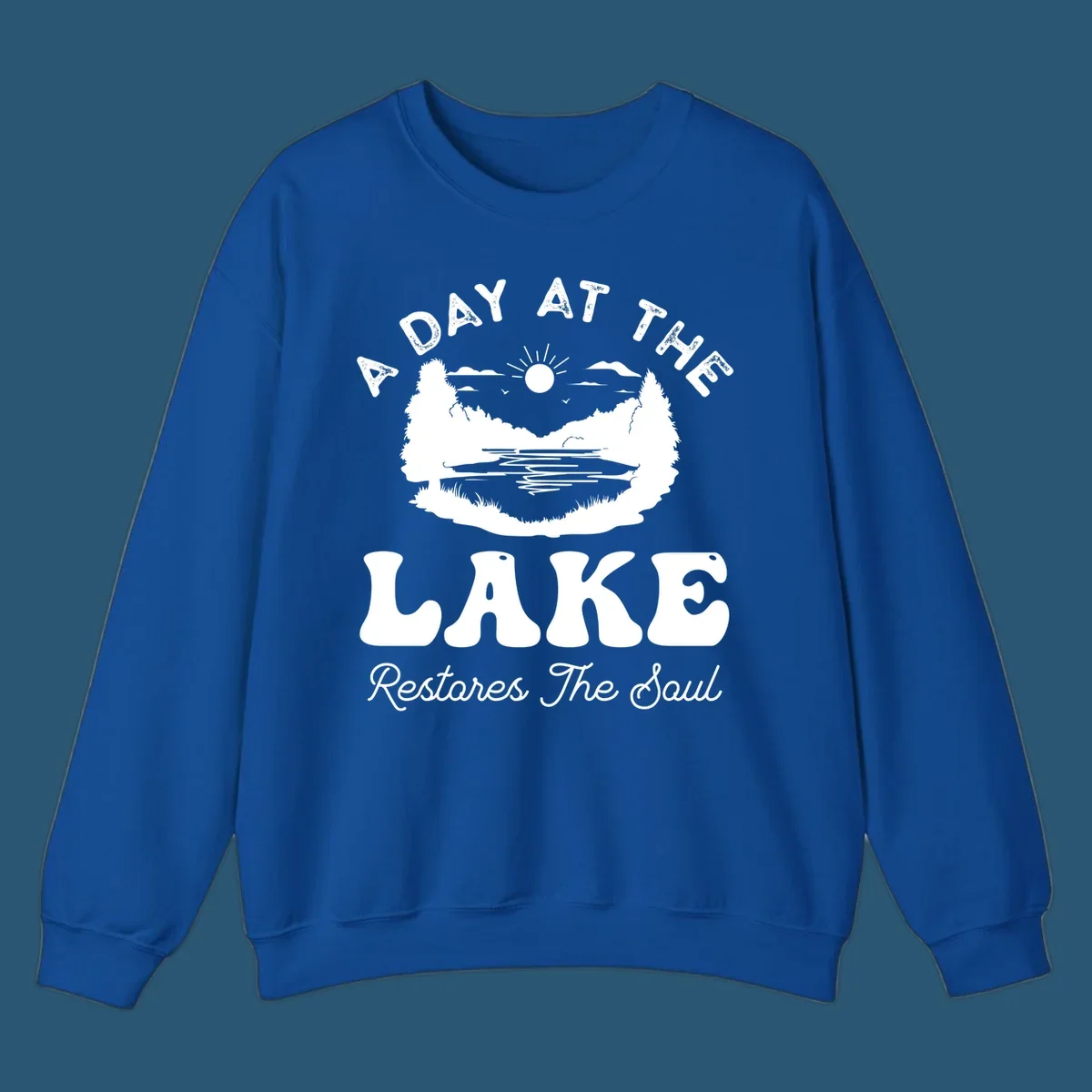 A day at the lake restores the soul graphic with lake scene and text