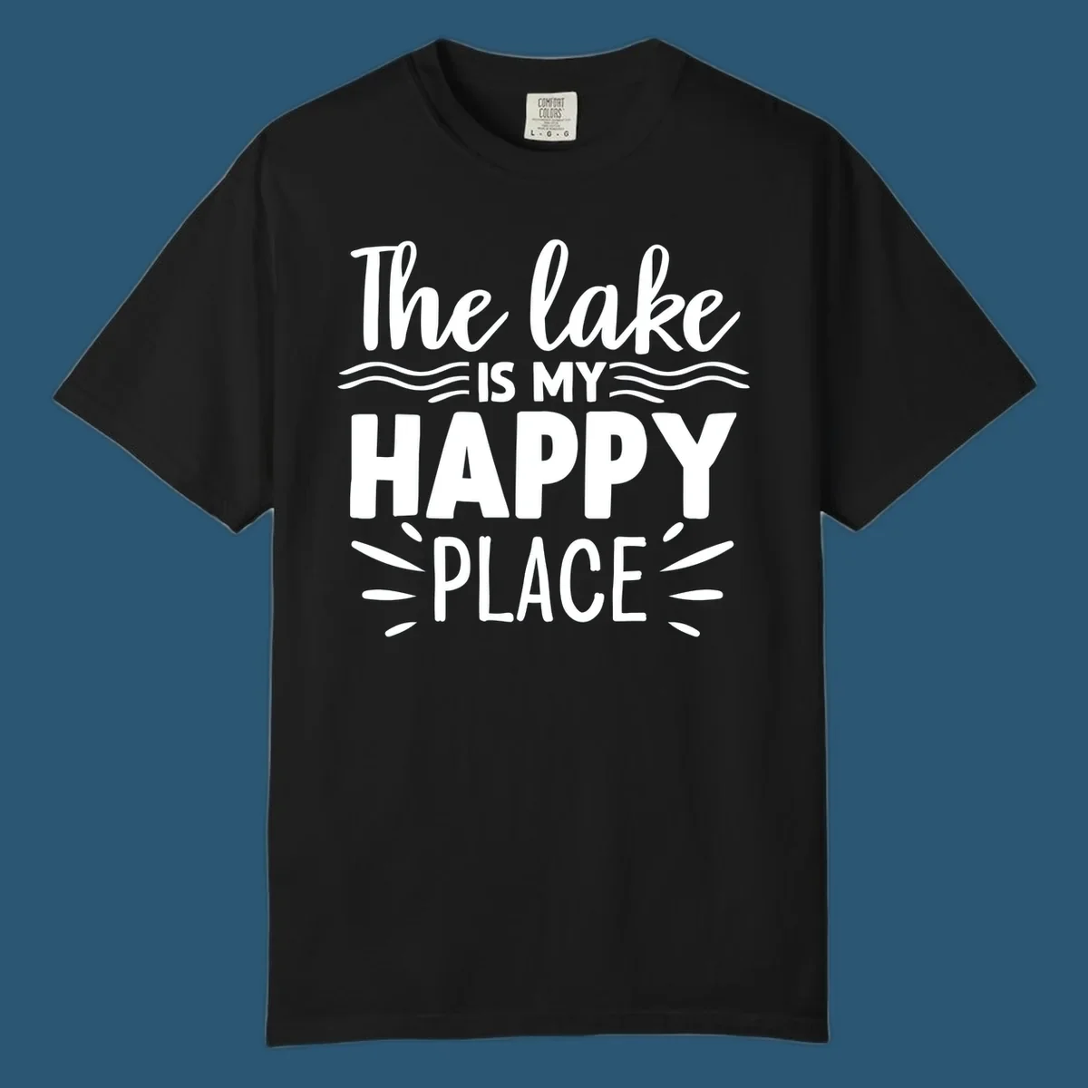 The lake is my happy place text design with wave and sun ray graphics.