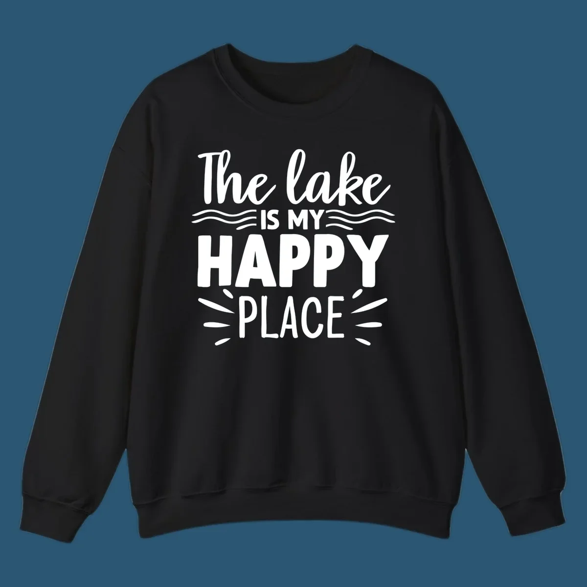 The lake is my happy place text design with wave and sun ray graphics.