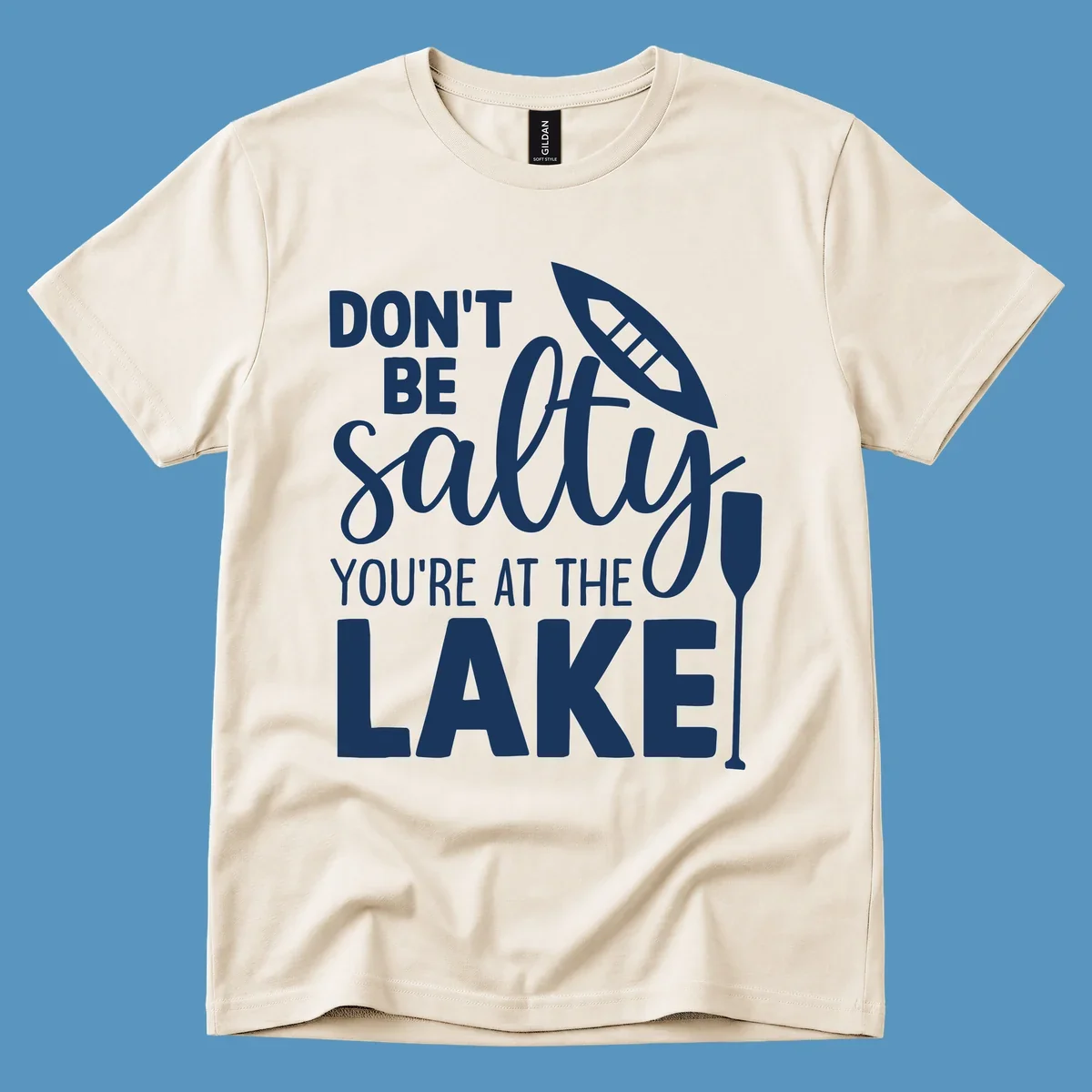 Don't be salty you're at the lake text with canoe and oar graphic.