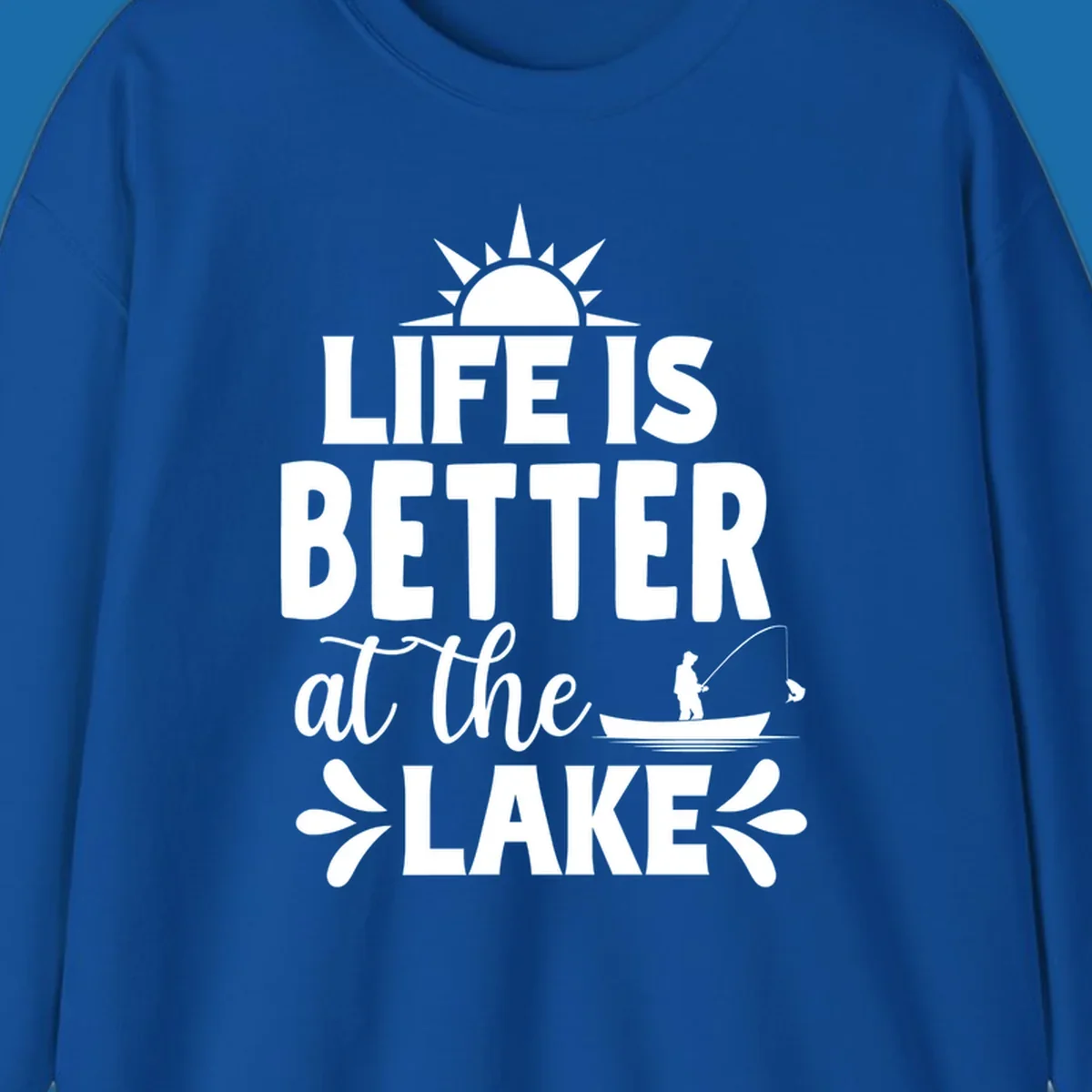 Life is better at the lake design with sun, fisherman, and fish.