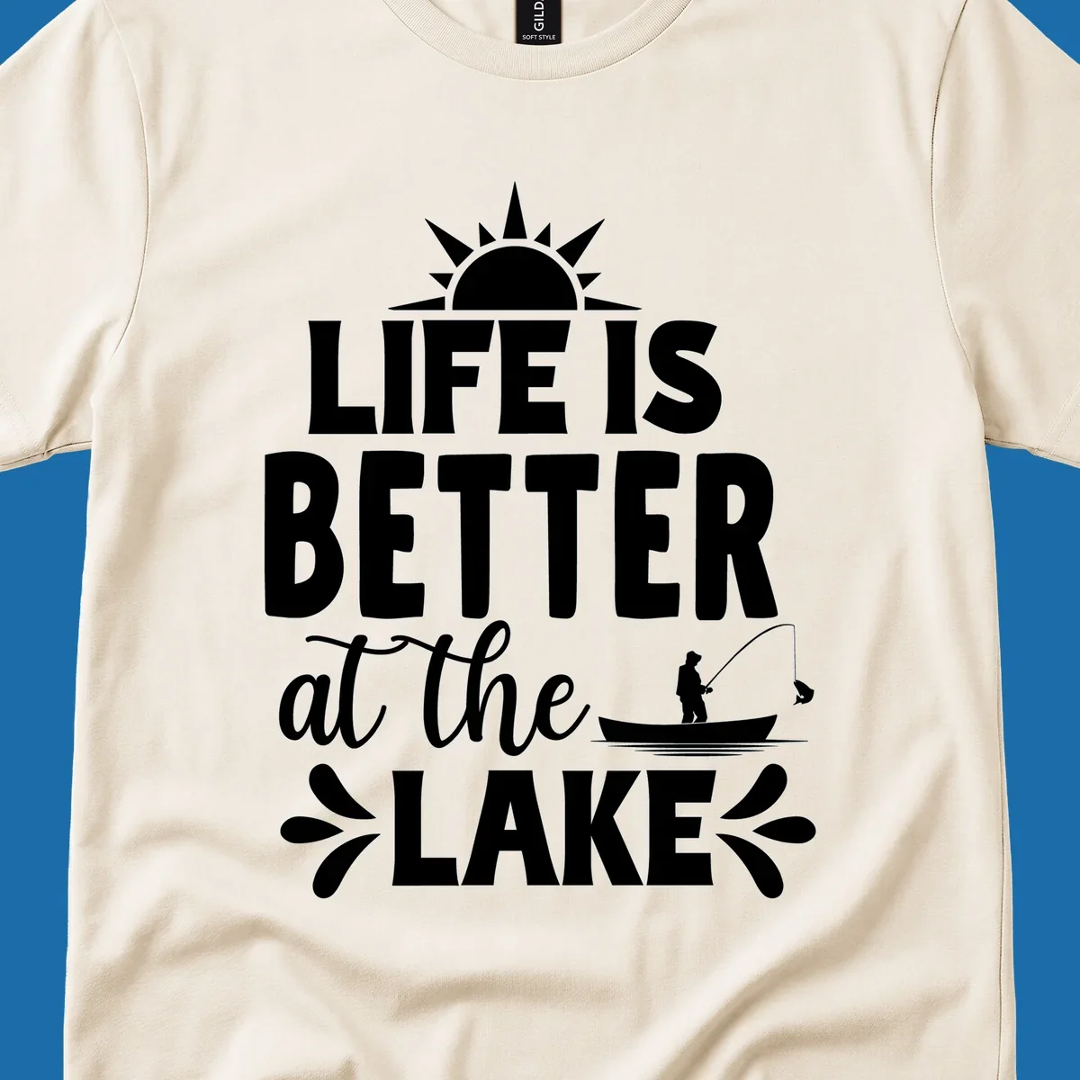 Life is better at the lake design with sun, fisherman, and fish.