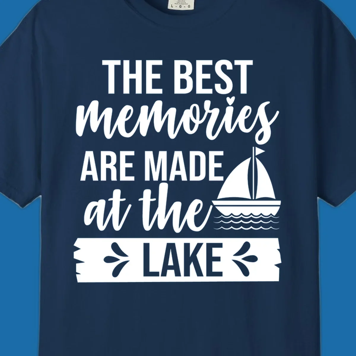 The Best Memories Are Made At The Lake text with sailboat graphic