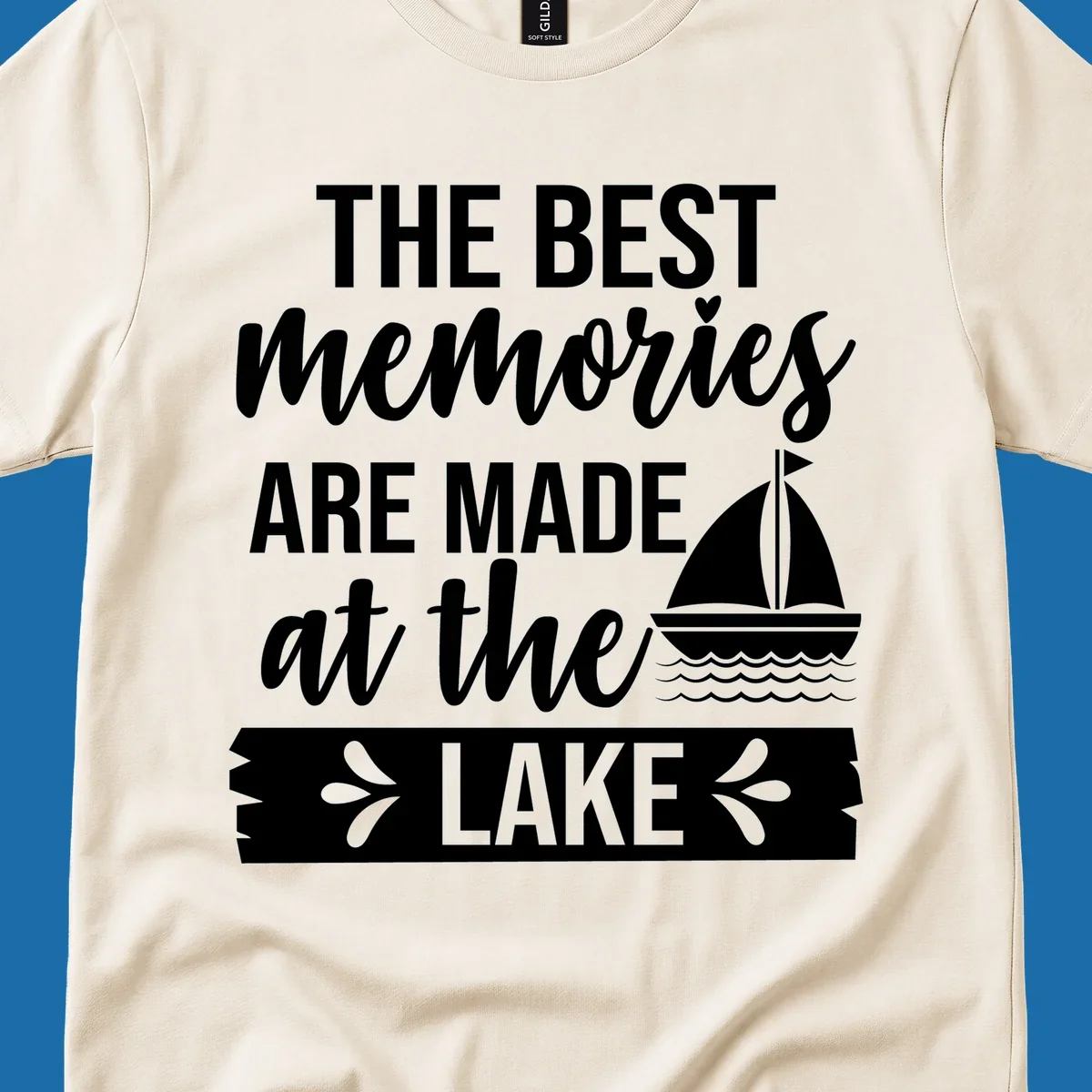 The Best Memories Are Made At The Lake text with sailboat graphic