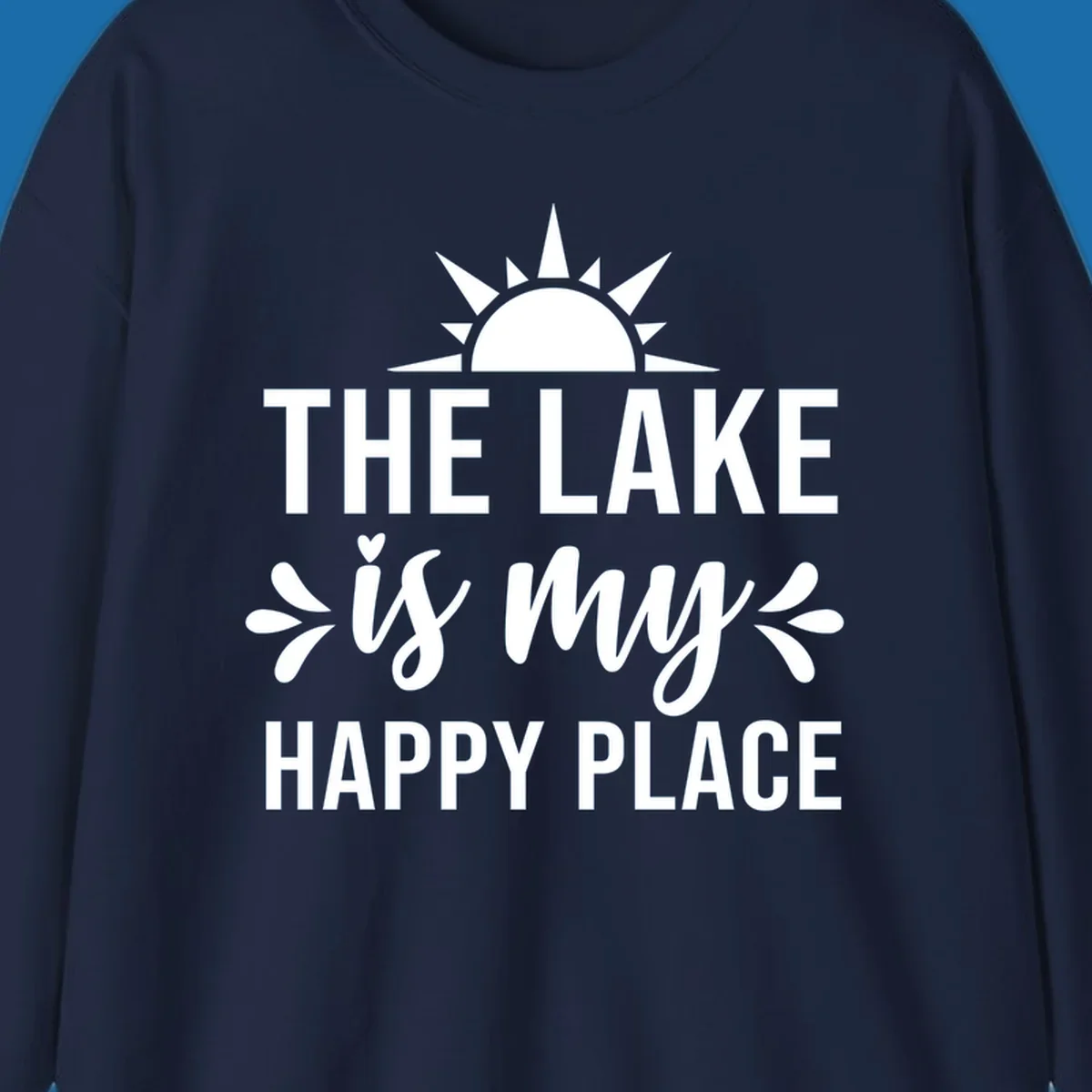 The Lake Is My Happy Place typography design with sun graphic.