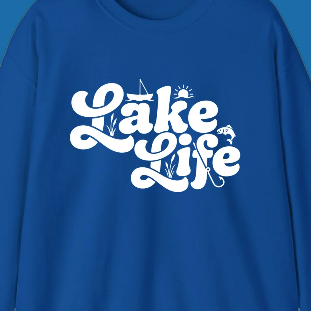 Retro Lake Life script design featuring a sailboat, sun, fish, and fishing hook.