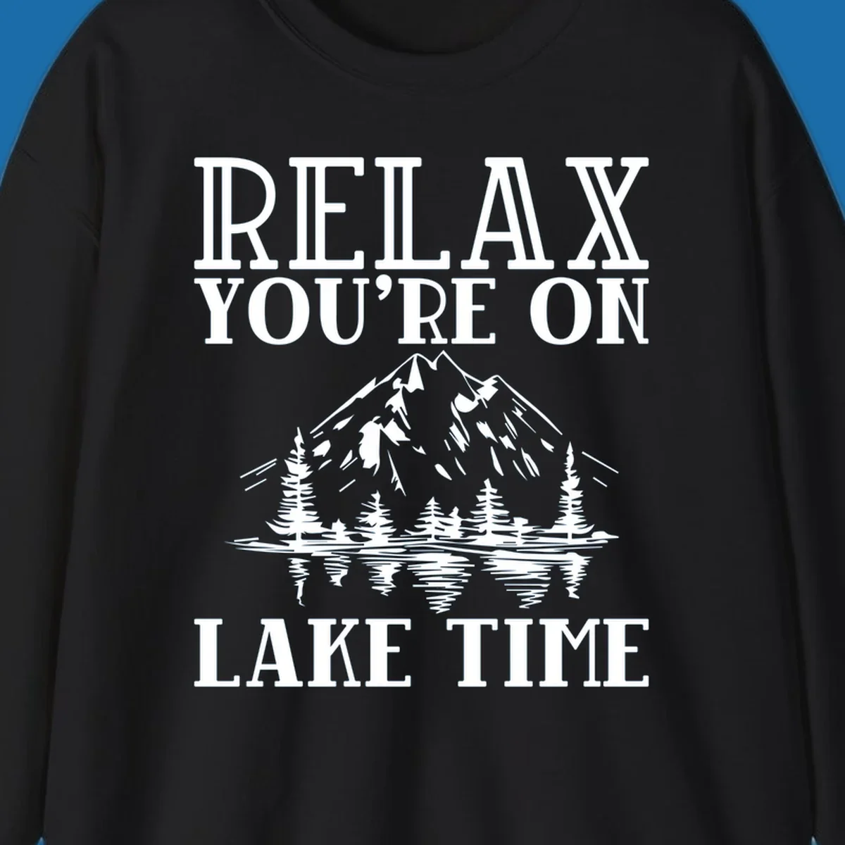 Relax You're On Lake Time text with mountains, trees, and lake reflection.