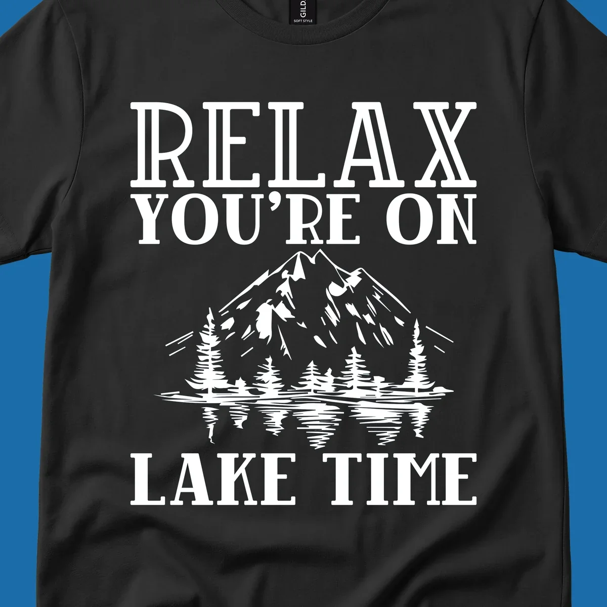 Relax You're On Lake Time text with mountains, trees, and lake reflection.
