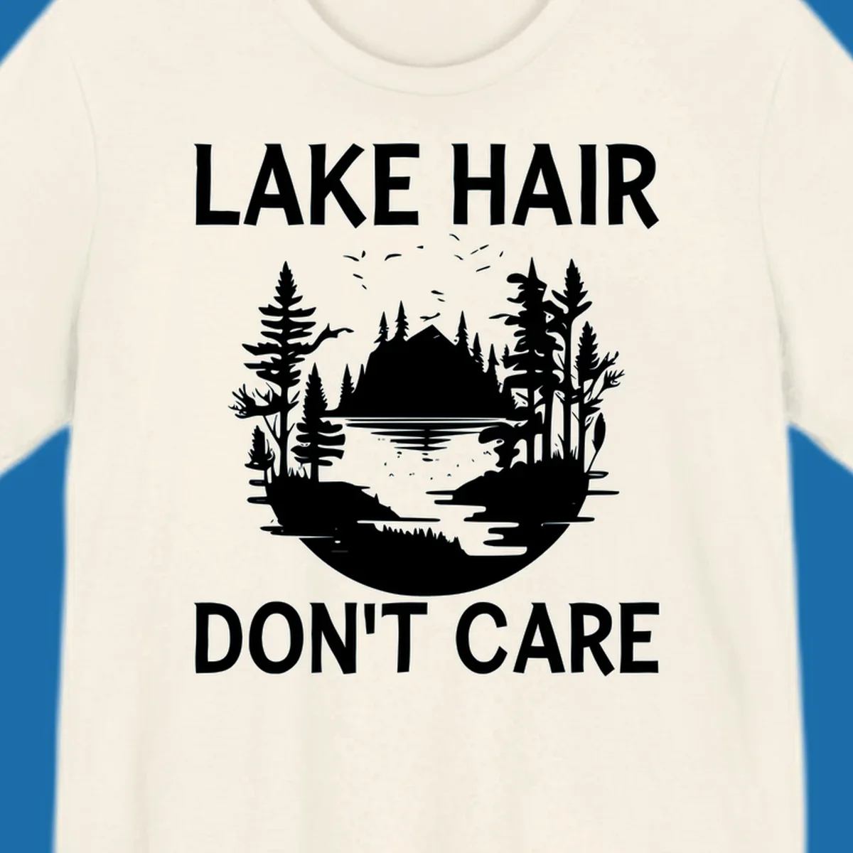 Lake Hair Don't Care design featuring a silhouette of a lake, trees, and mountains.