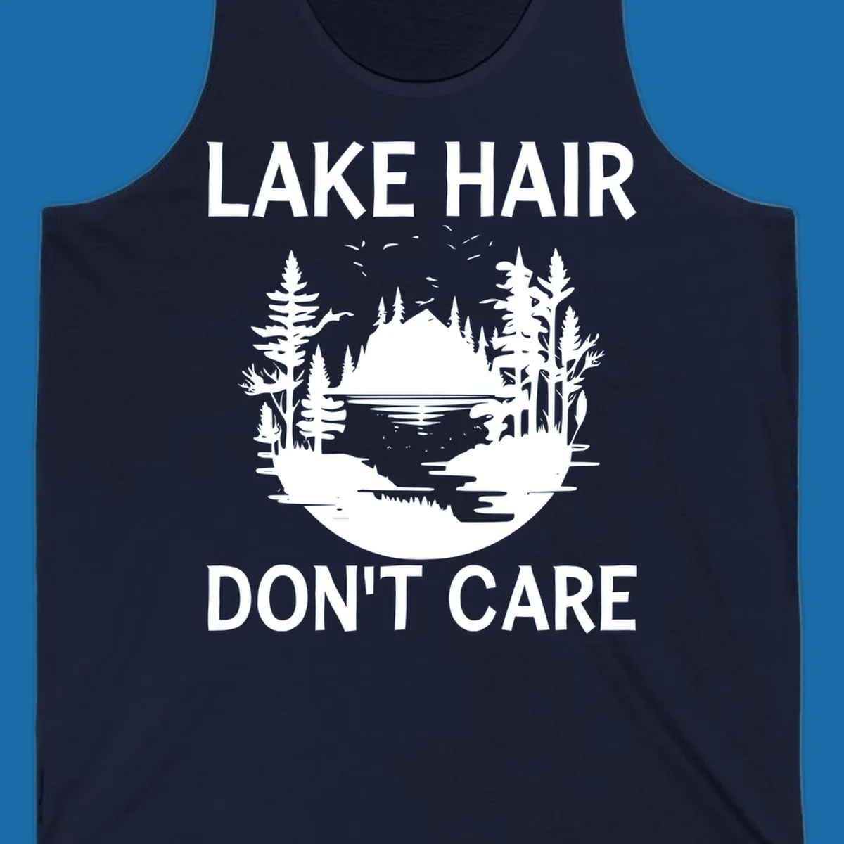 Lake Hair Don't Care design featuring a silhouette of a lake, trees, and mountains.