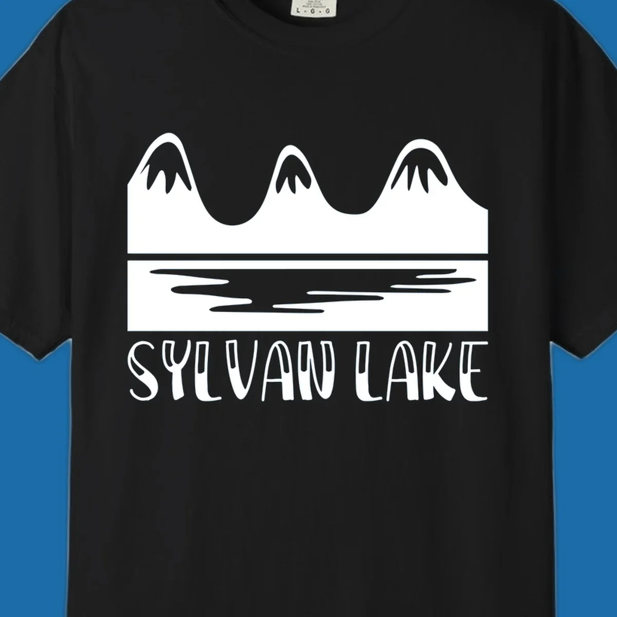 Sylvan Lake mountains reflected in water, with text 'SYLVAN LAKE'.