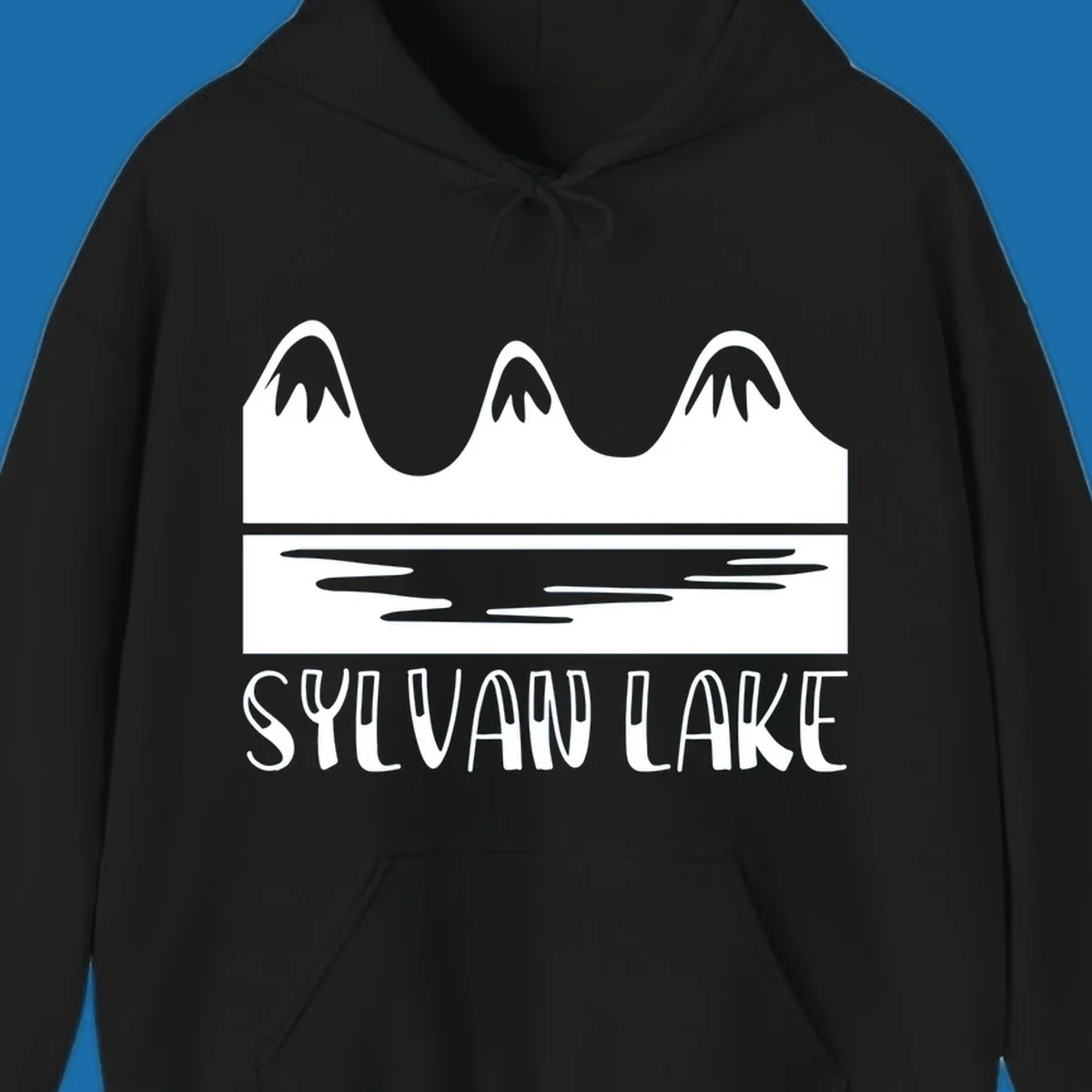 Sylvan Lake mountains reflected in water, with text 'SYLVAN LAKE'.