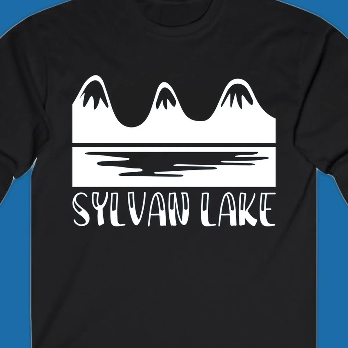 Sylvan Lake mountains reflected in water, with text 'SYLVAN LAKE'.
