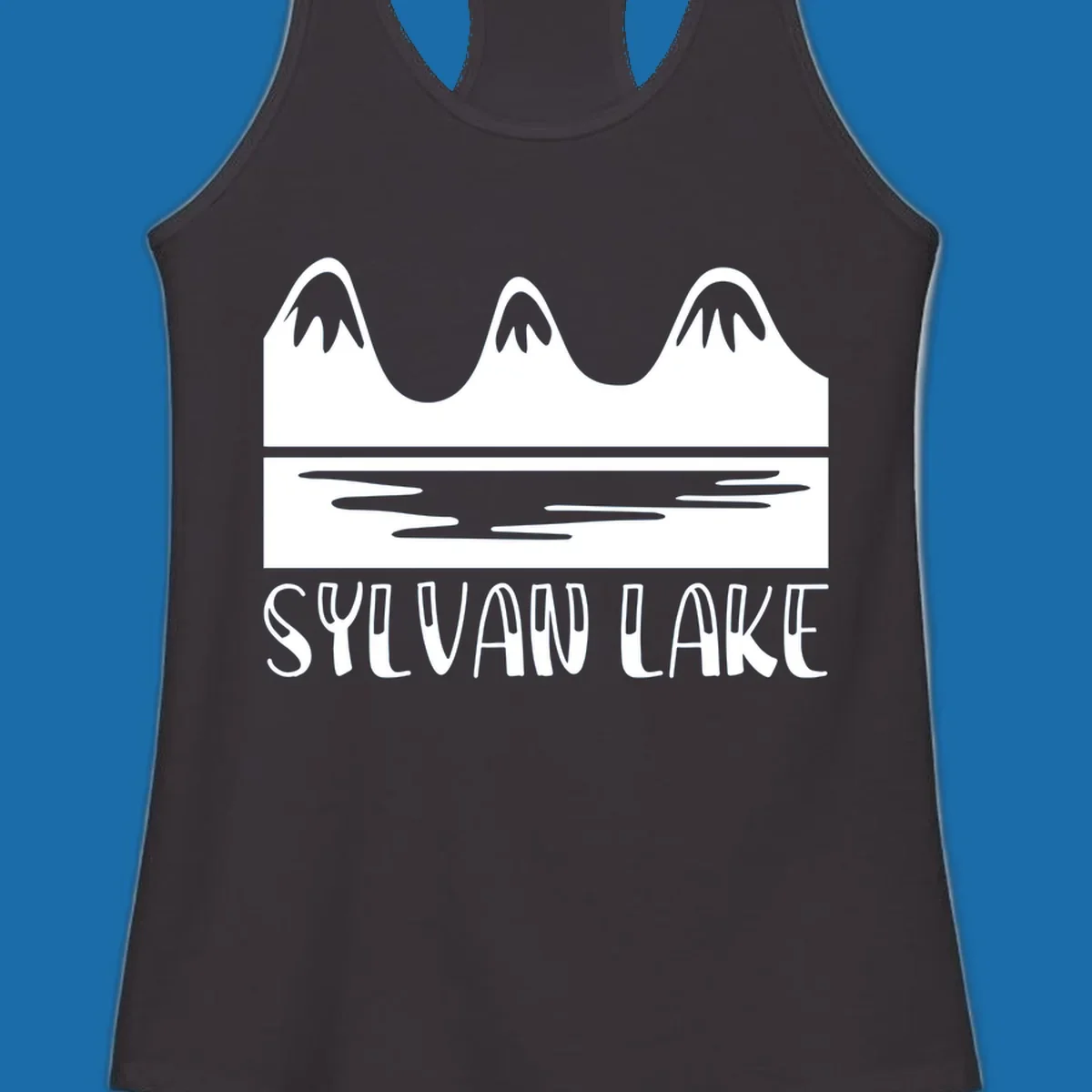 Sylvan Lake mountains reflected in water, with text 'SYLVAN LAKE'.