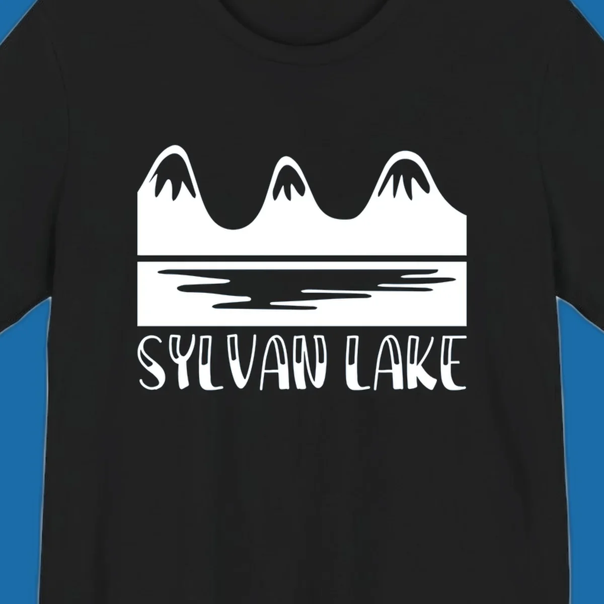 Sylvan Lake mountains reflected in water, with text 'SYLVAN LAKE'.