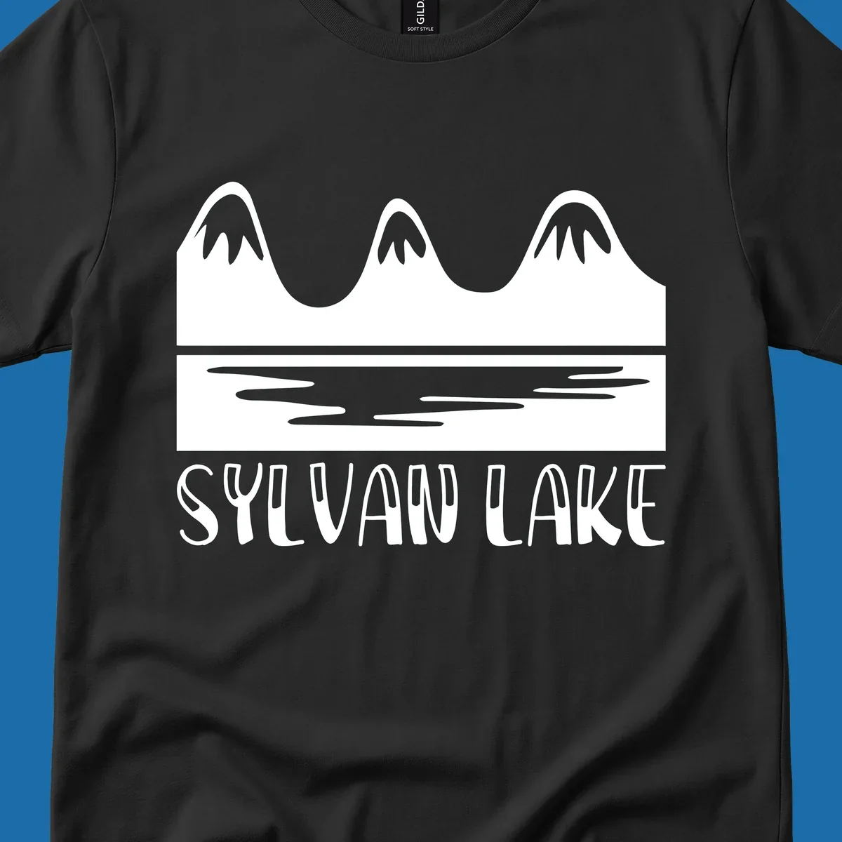 Sylvan Lake mountains reflected in water, with text 'SYLVAN LAKE'.