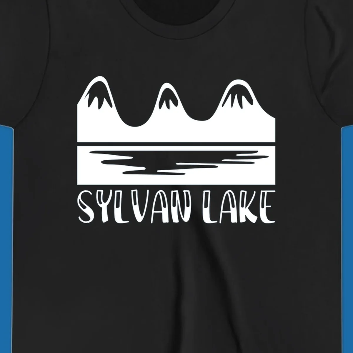 Sylvan Lake mountains reflected in water, with text 'SYLVAN LAKE'.
