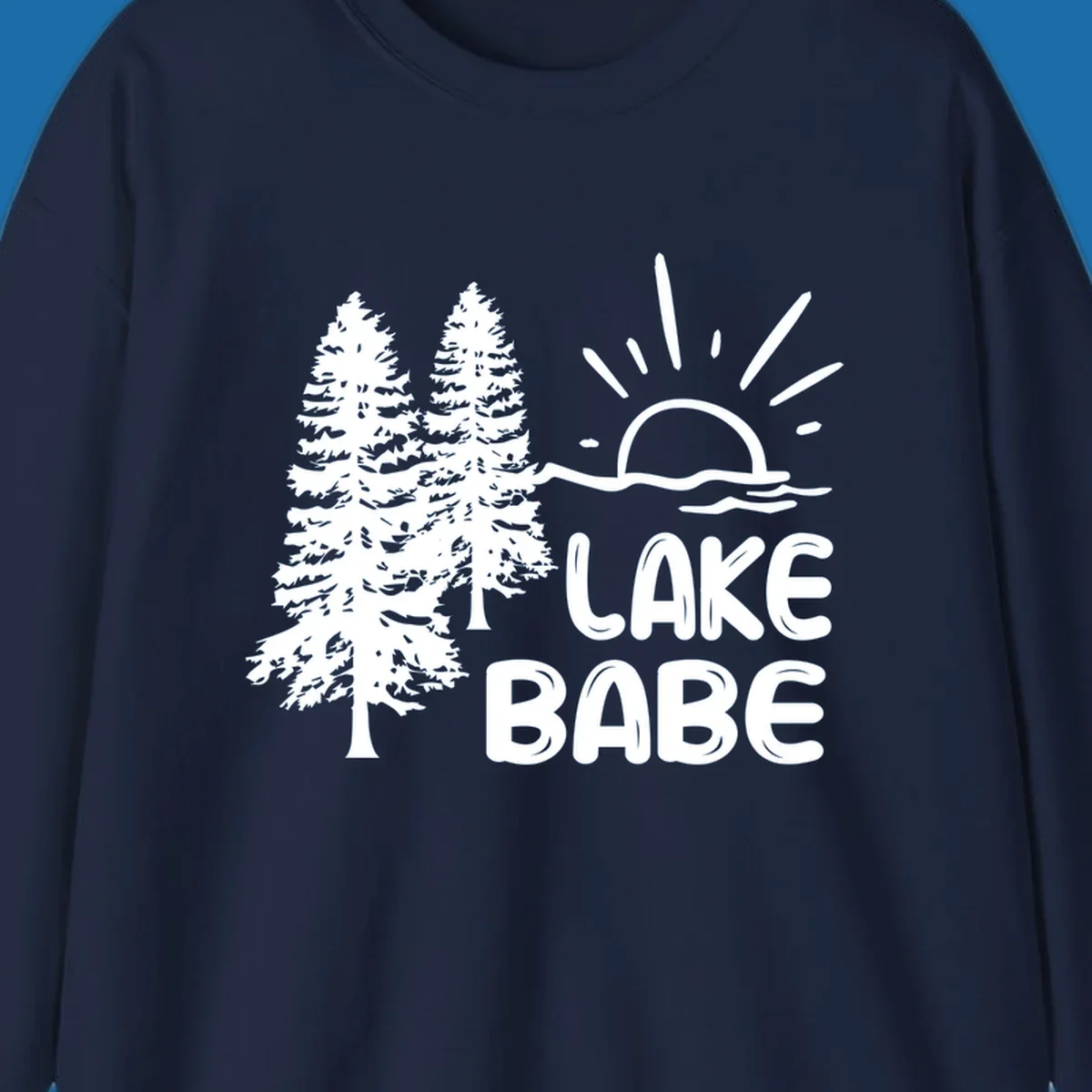 White graphic of pine trees, sun rising over water, and text 'LAKE BABE' on a black background.