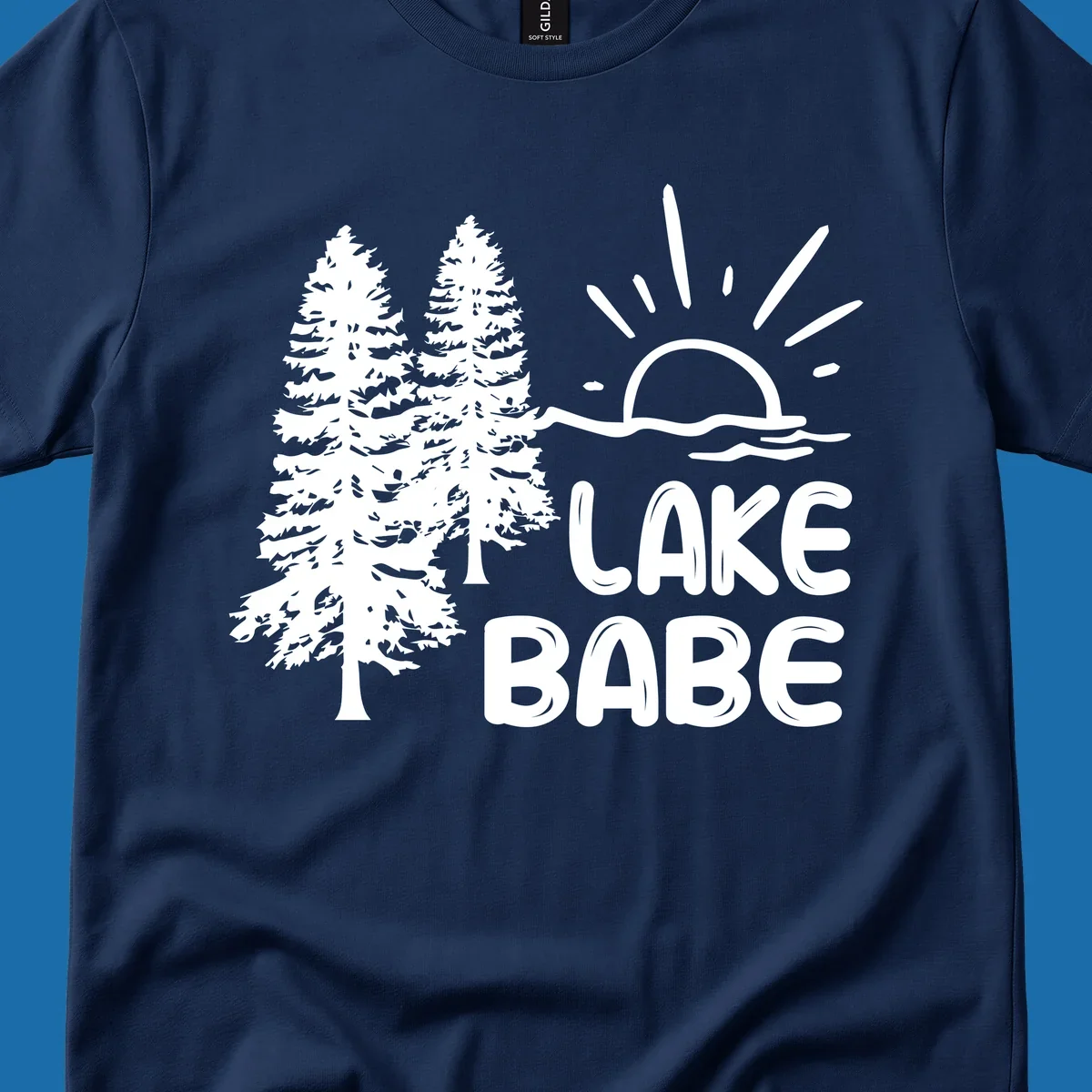 White graphic of pine trees, sun rising over water, and text 'LAKE BABE' on a black background.