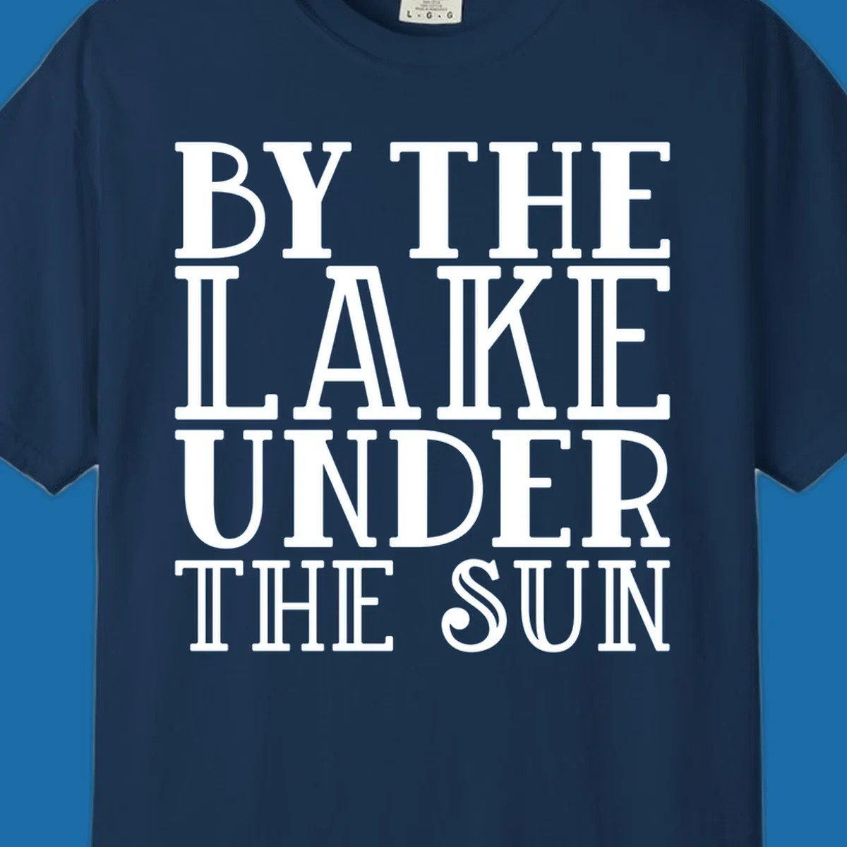 Text design 'BY THE LAKE UNDER THE SUN' in white serif font.