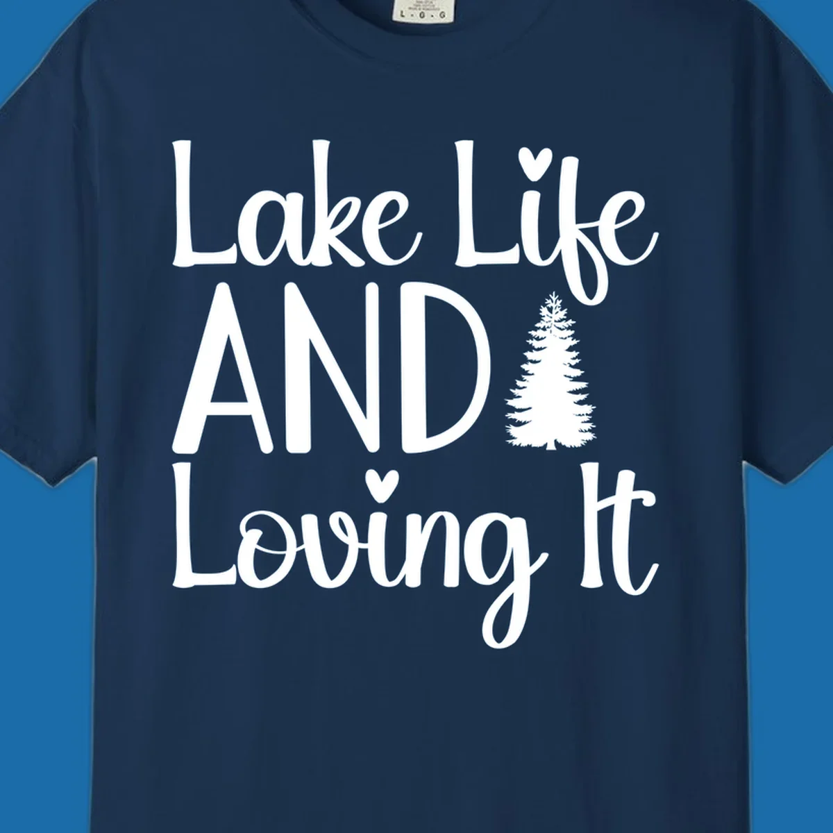 Lake Life And Loving It text with pine tree and heart graphics.