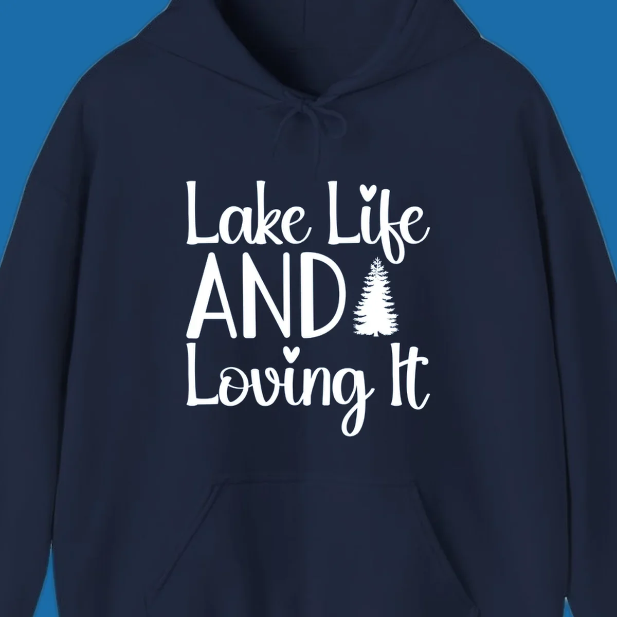 Lake Life And Loving It text with pine tree and heart graphics.