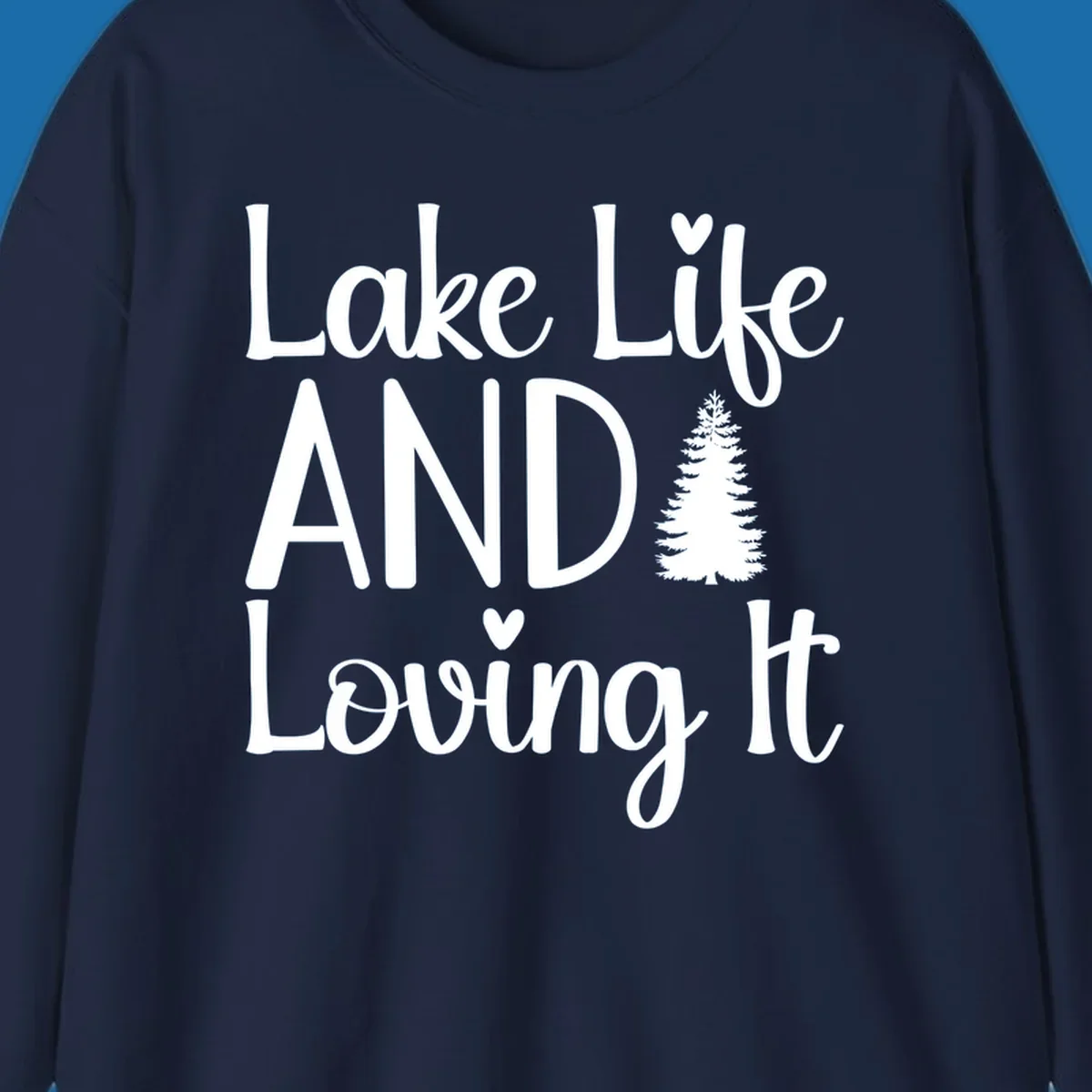 Lake Life And Loving It text with pine tree and heart graphics.