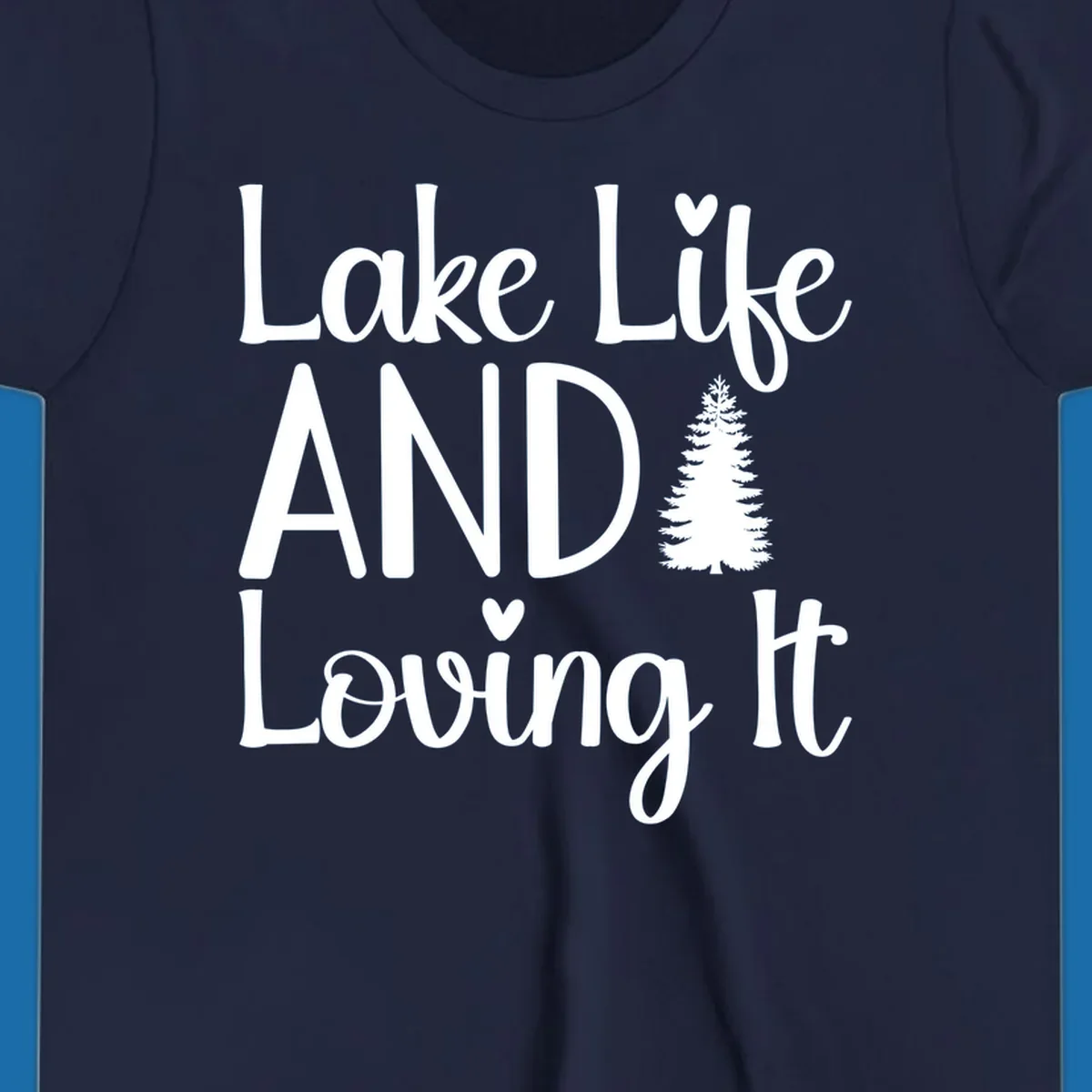 Lake Life And Loving It text with pine tree and heart graphics.