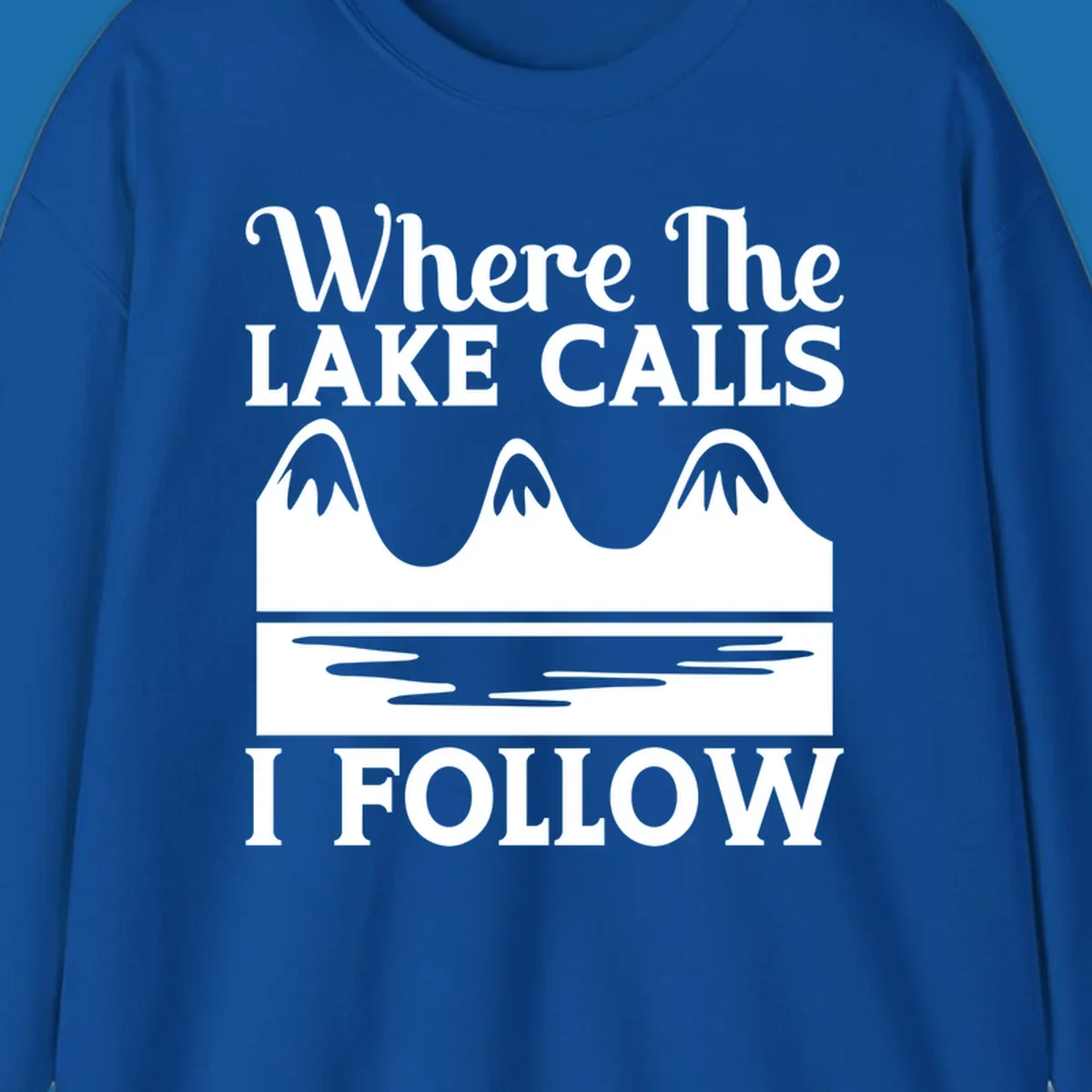 Mountains and lake graphic with text 'Where The LAKE CALLS I FOLLOW'.