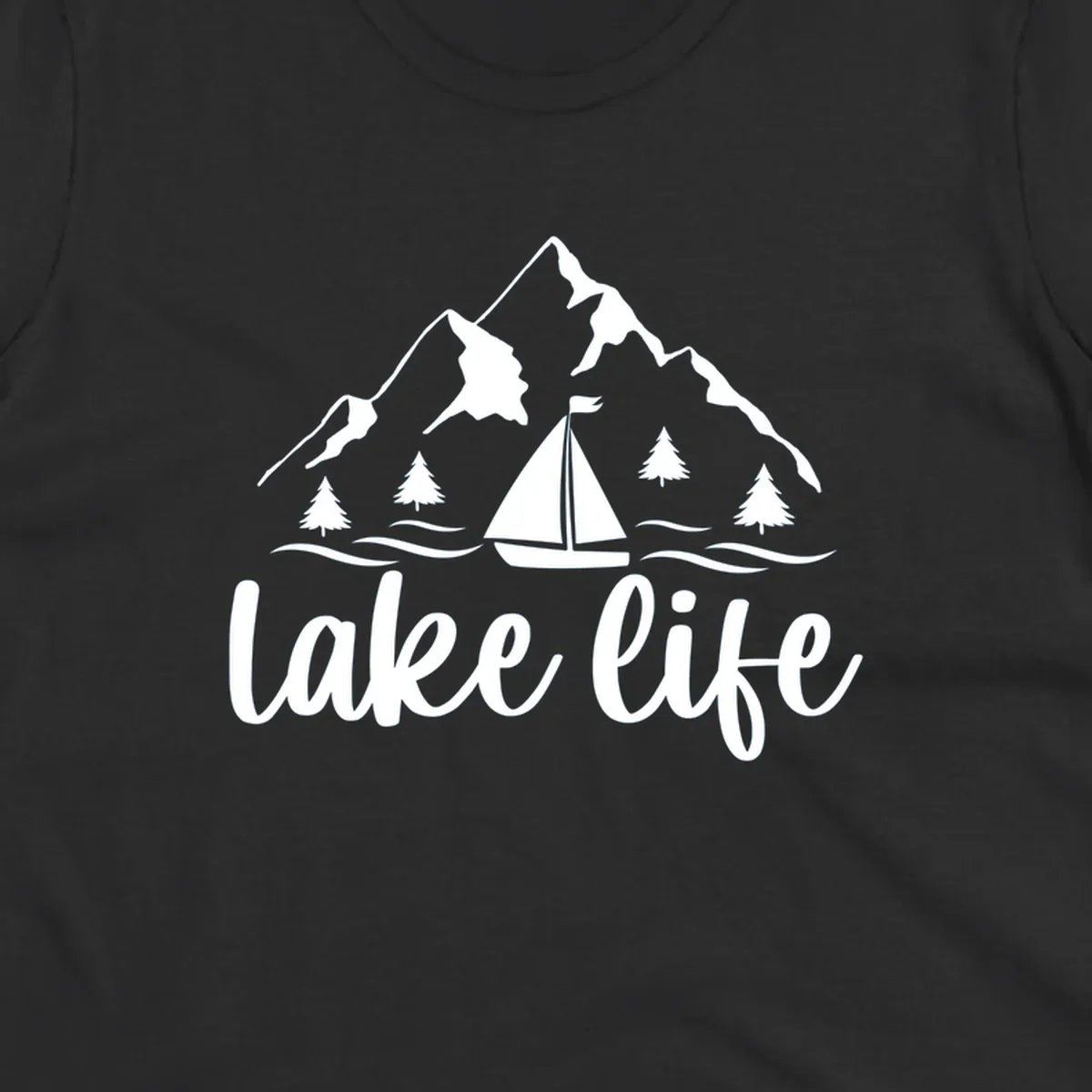 Lake life mountain sailboat scenic design with mountains, trees, sailboat, and text.