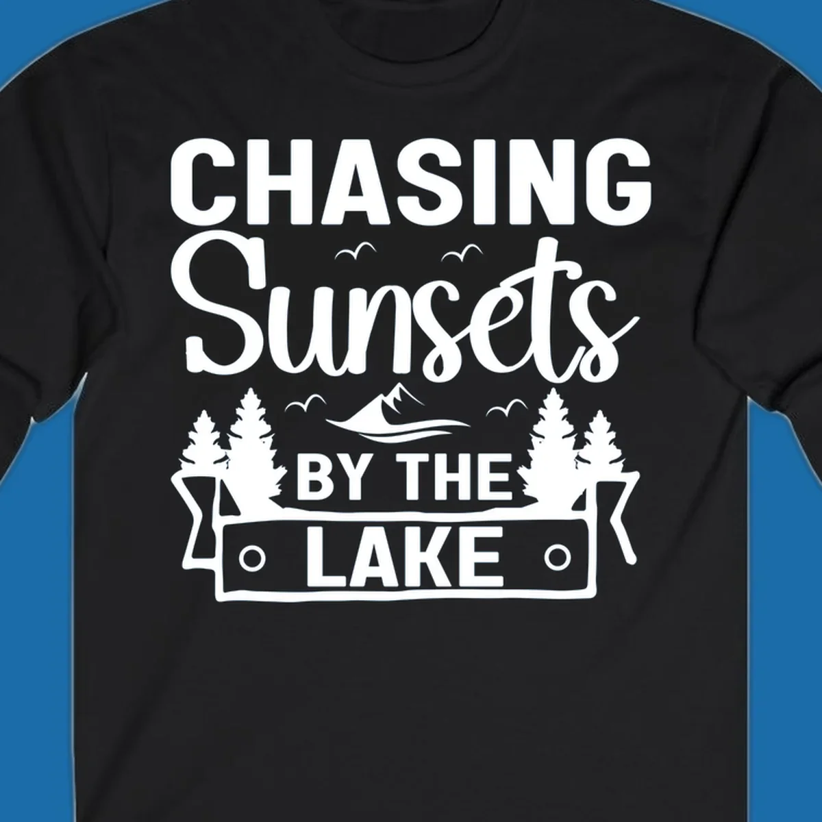 Chasing sunsets by the lake design with text, trees, mountains, and birds.