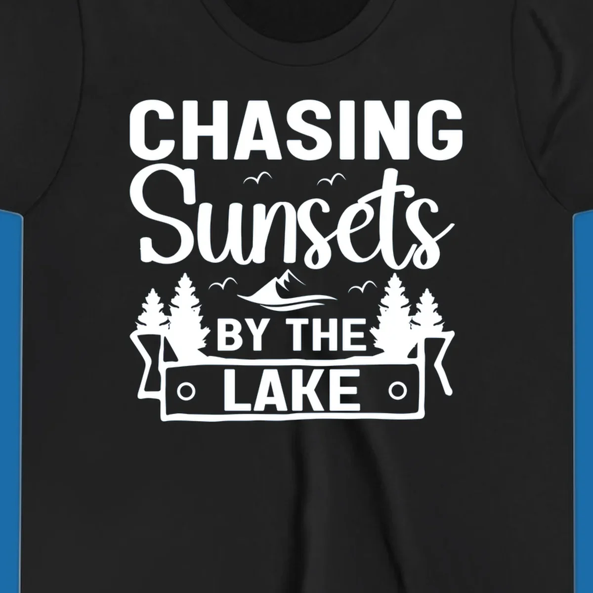 Chasing sunsets by the lake design with text, trees, mountains, and birds.