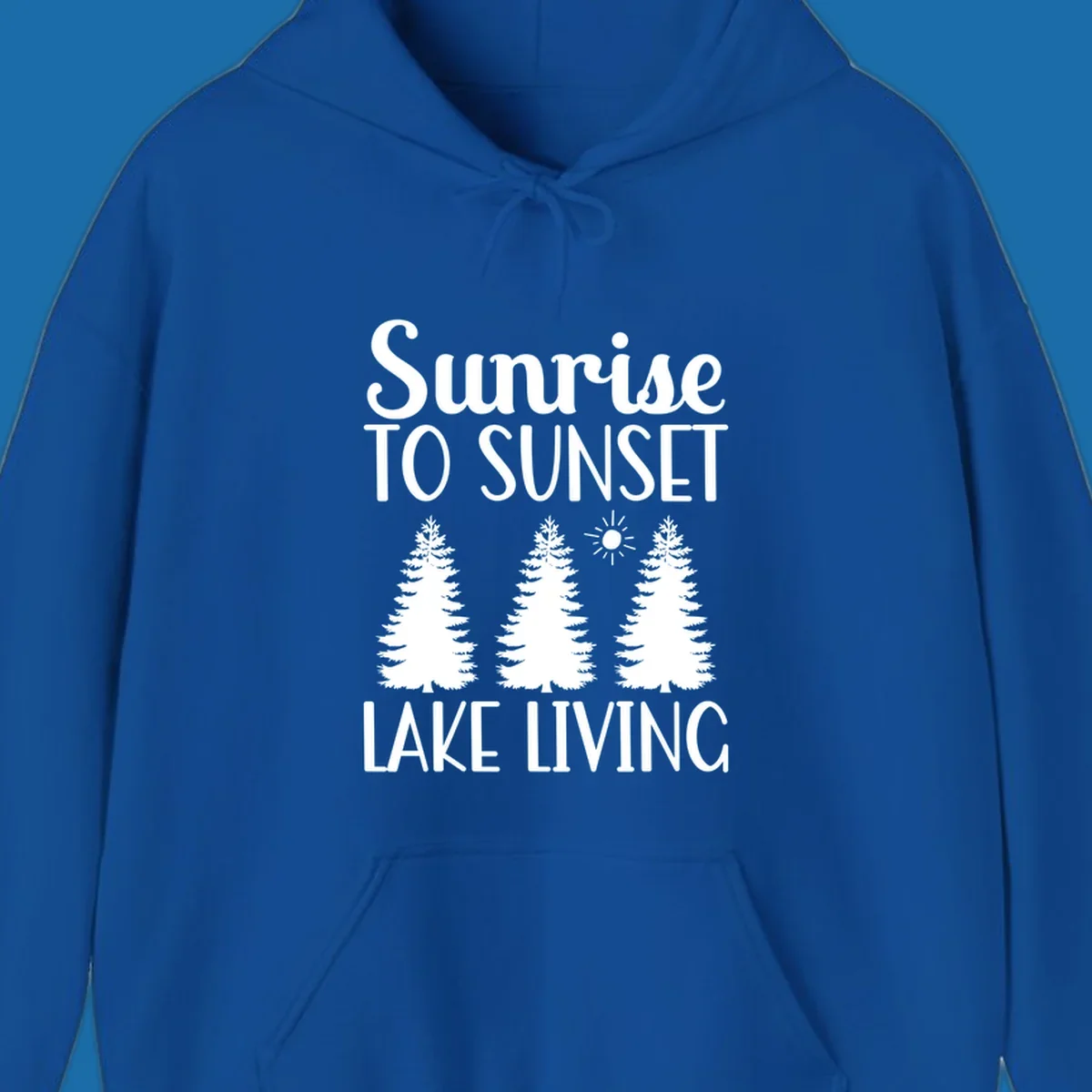 Sunrise to sunset lake living text with pine trees and sun graphic. lake-living-sunrise-sunset