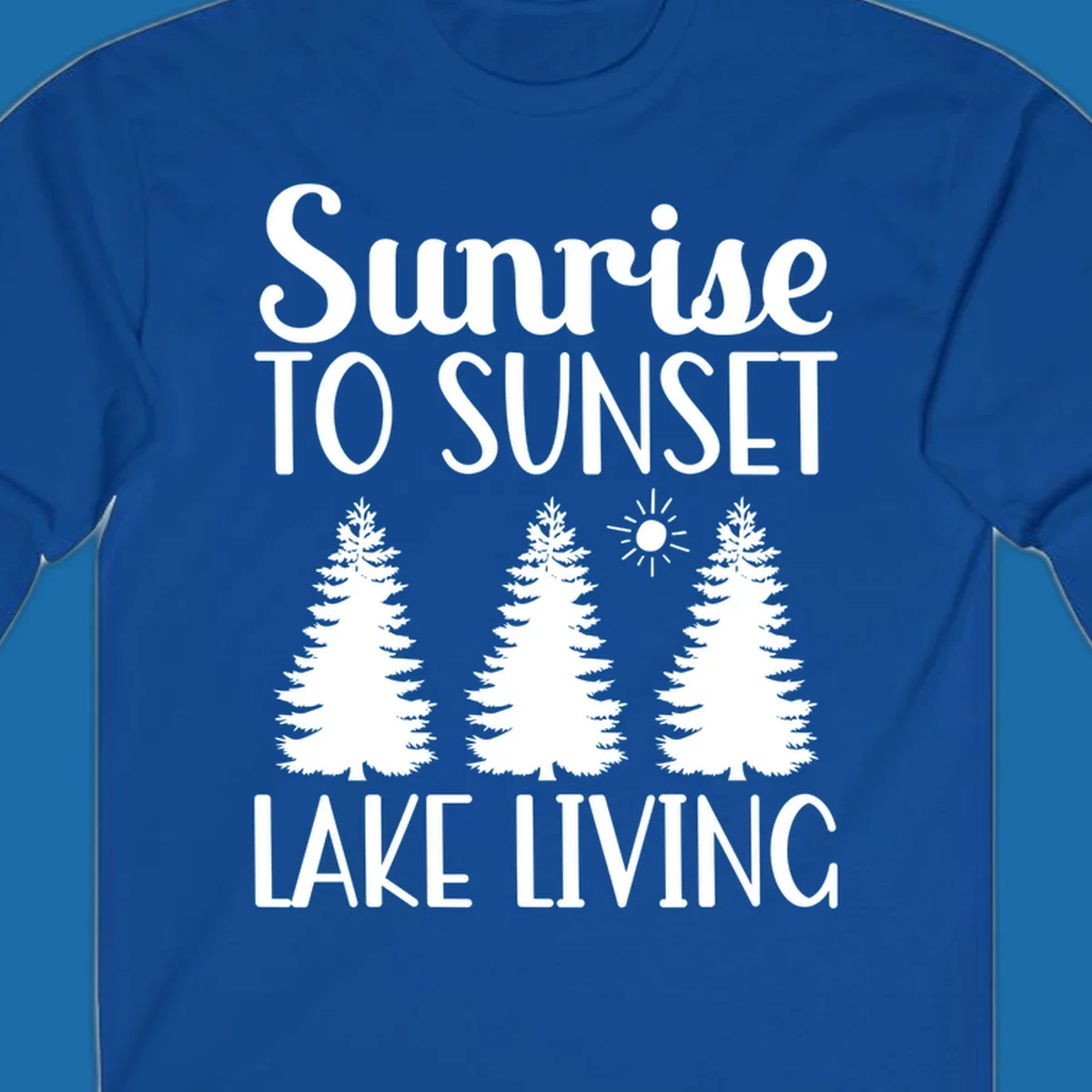 Sunrise to sunset lake living text with pine trees and sun graphic. lake-living-sunrise-sunset