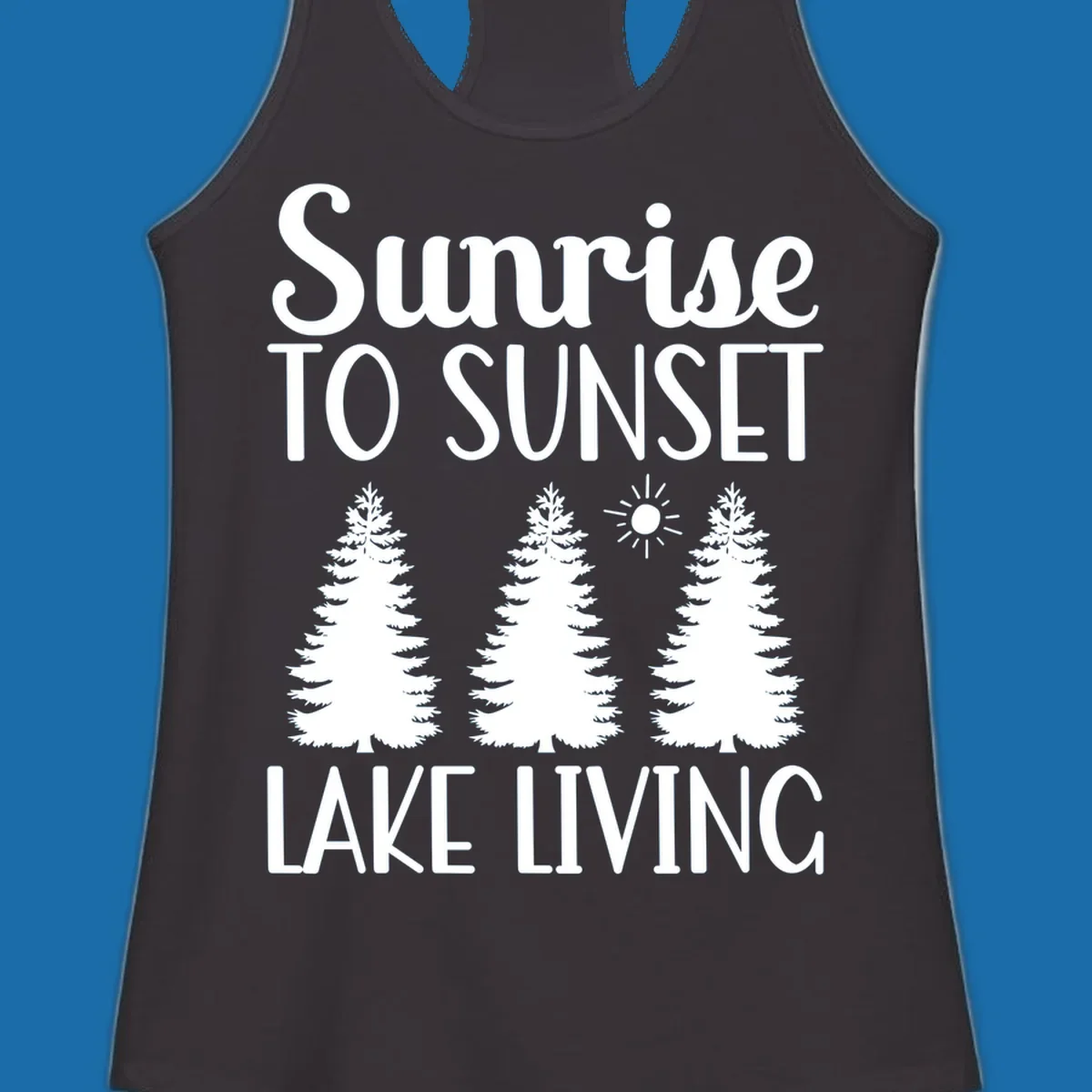 Sunrise to sunset lake living text with pine trees and sun graphic. lake-living-sunrise-sunset