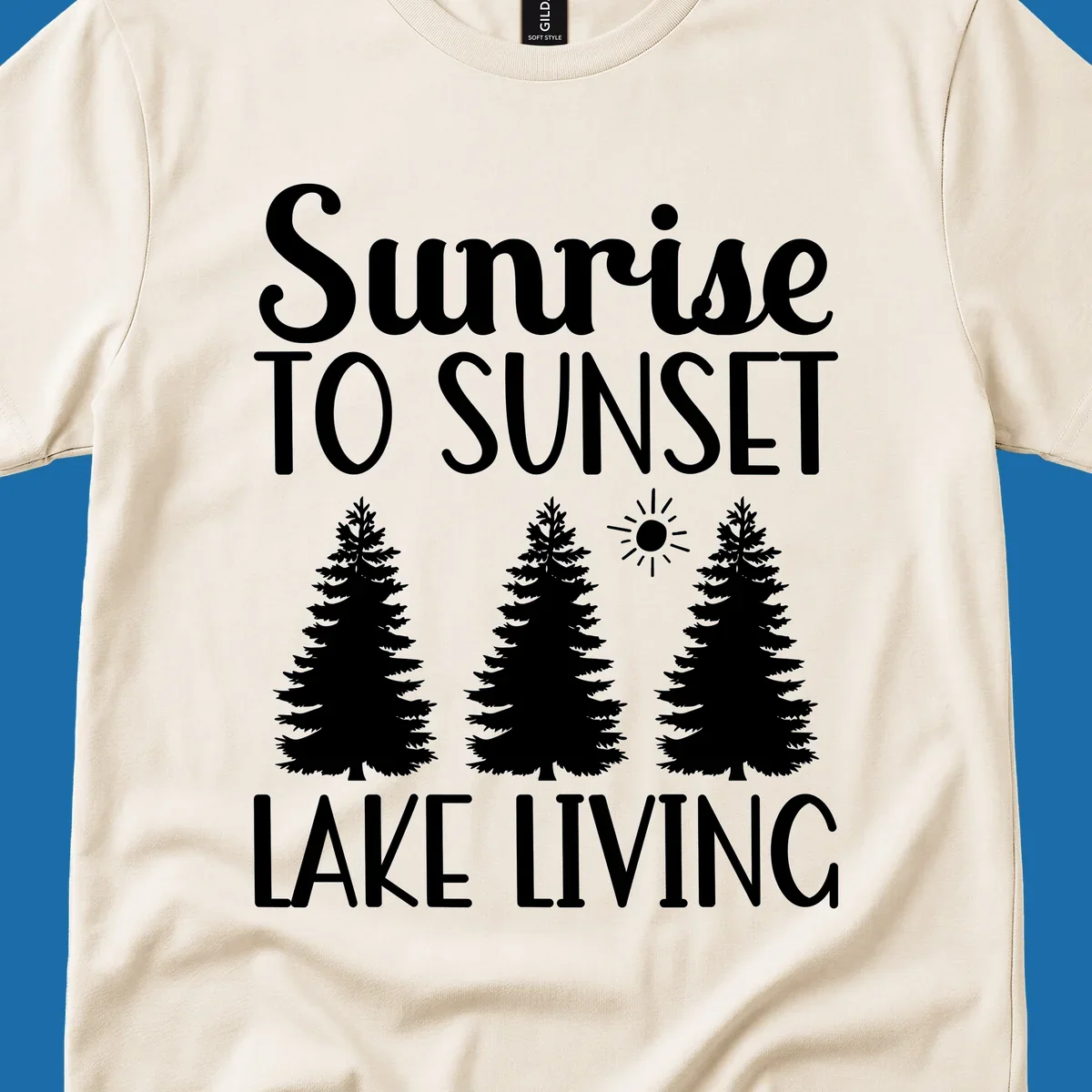 Sunrise to sunset lake living text with pine trees and sun graphic. lake-living-sunrise-sunset