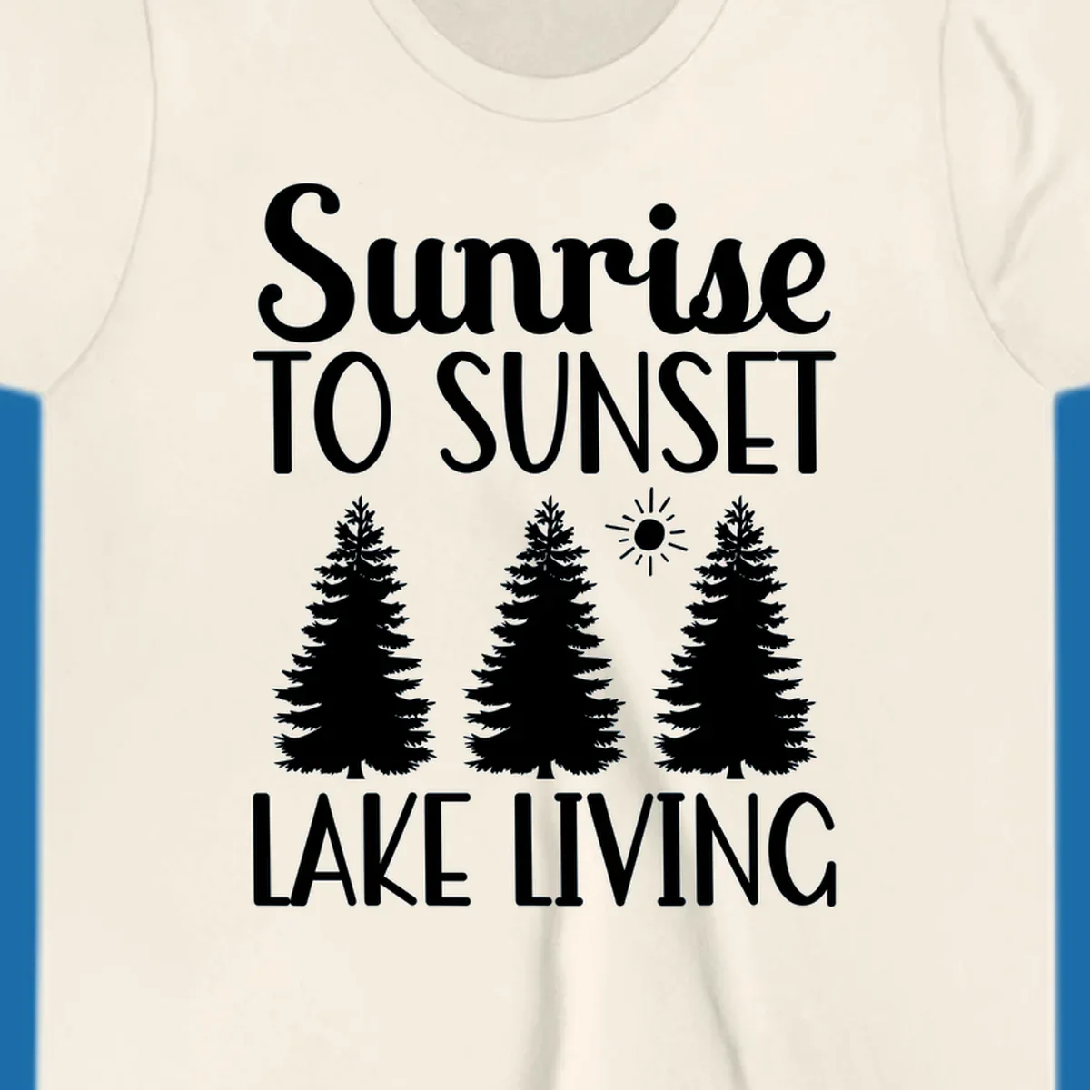 Sunrise to sunset lake living text with pine trees and sun graphic. lake-living-sunrise-sunset