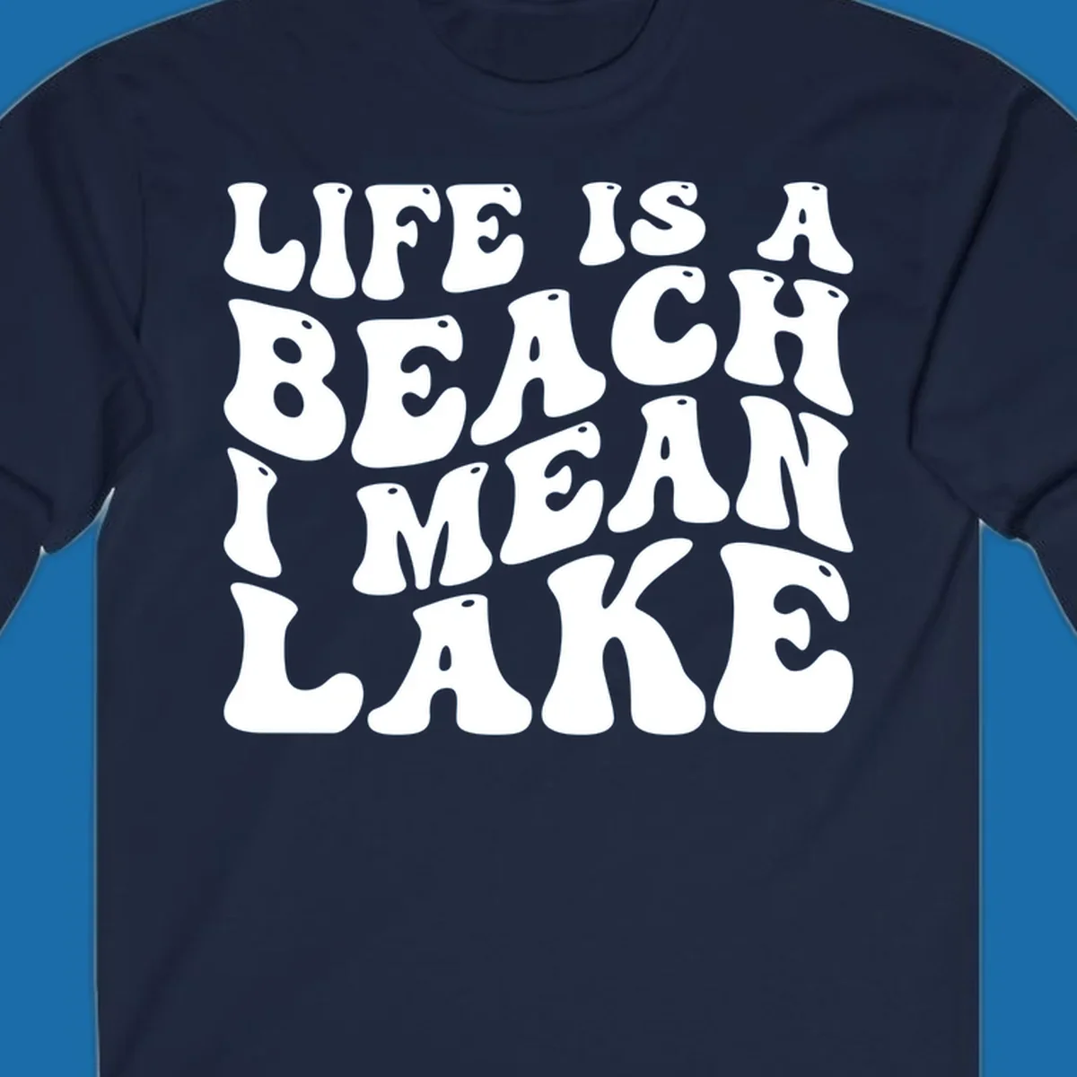 Retro typography design with the phrase "LIFE IS A BEACH I MEAN LAKE" for lake-themed apparel.