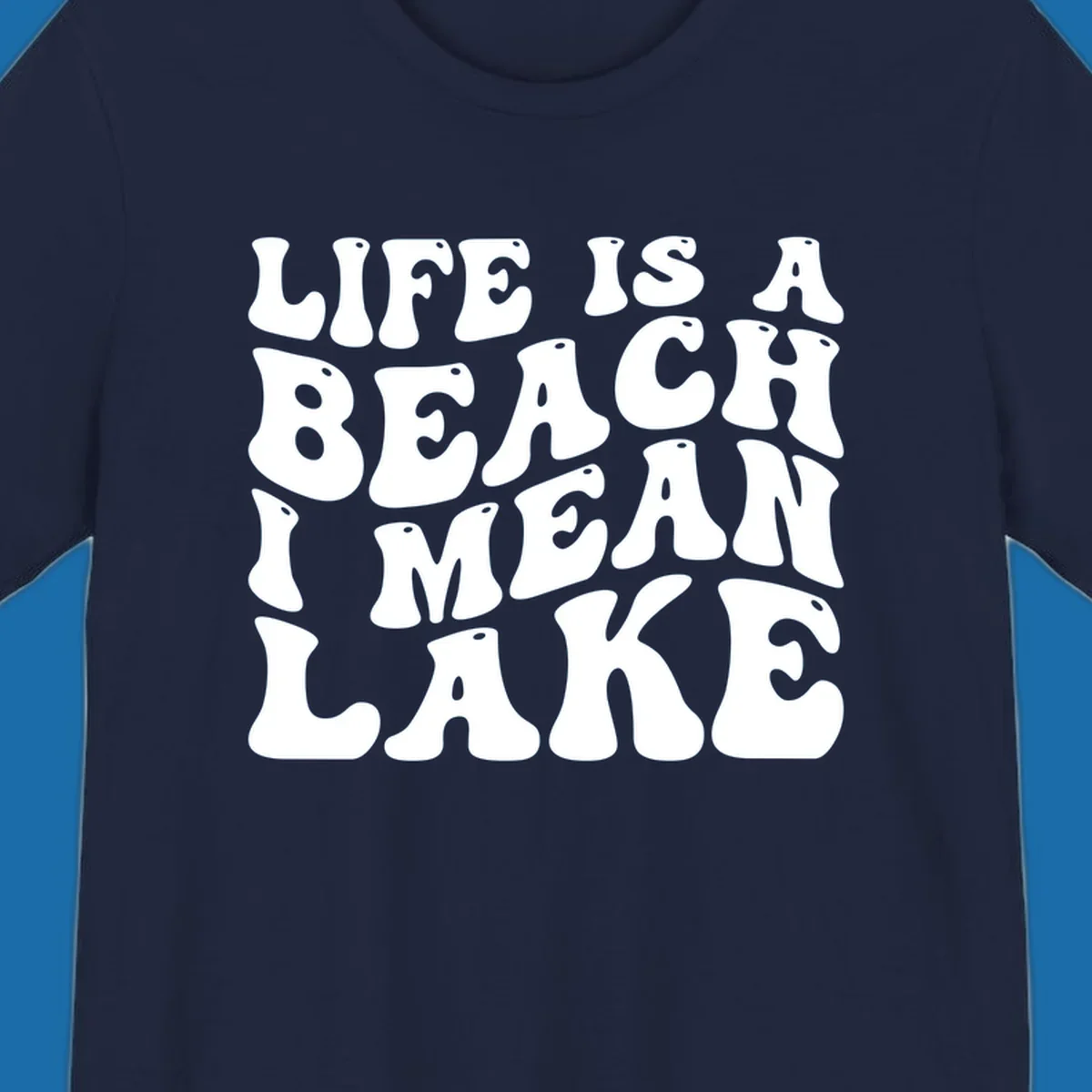 Retro typography design with the phrase "LIFE IS A BEACH I MEAN LAKE" for lake-themed apparel.