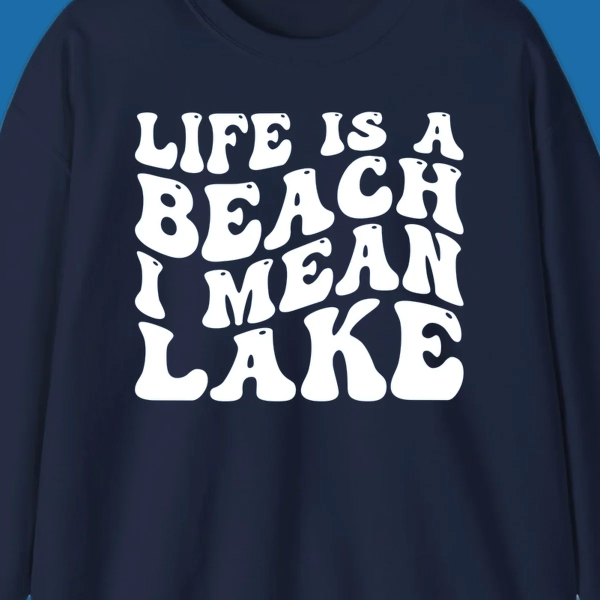 Retro typography design with the phrase "LIFE IS A BEACH I MEAN LAKE" for lake-themed apparel.