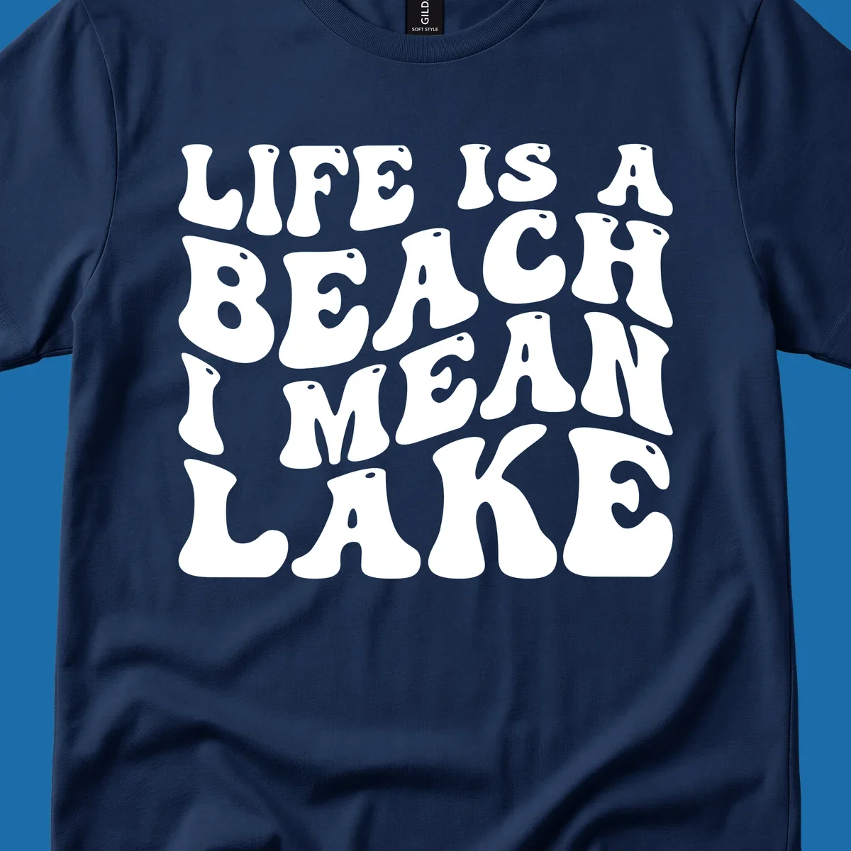 Retro typography design with the phrase "LIFE IS A BEACH I MEAN LAKE" for lake-themed apparel.