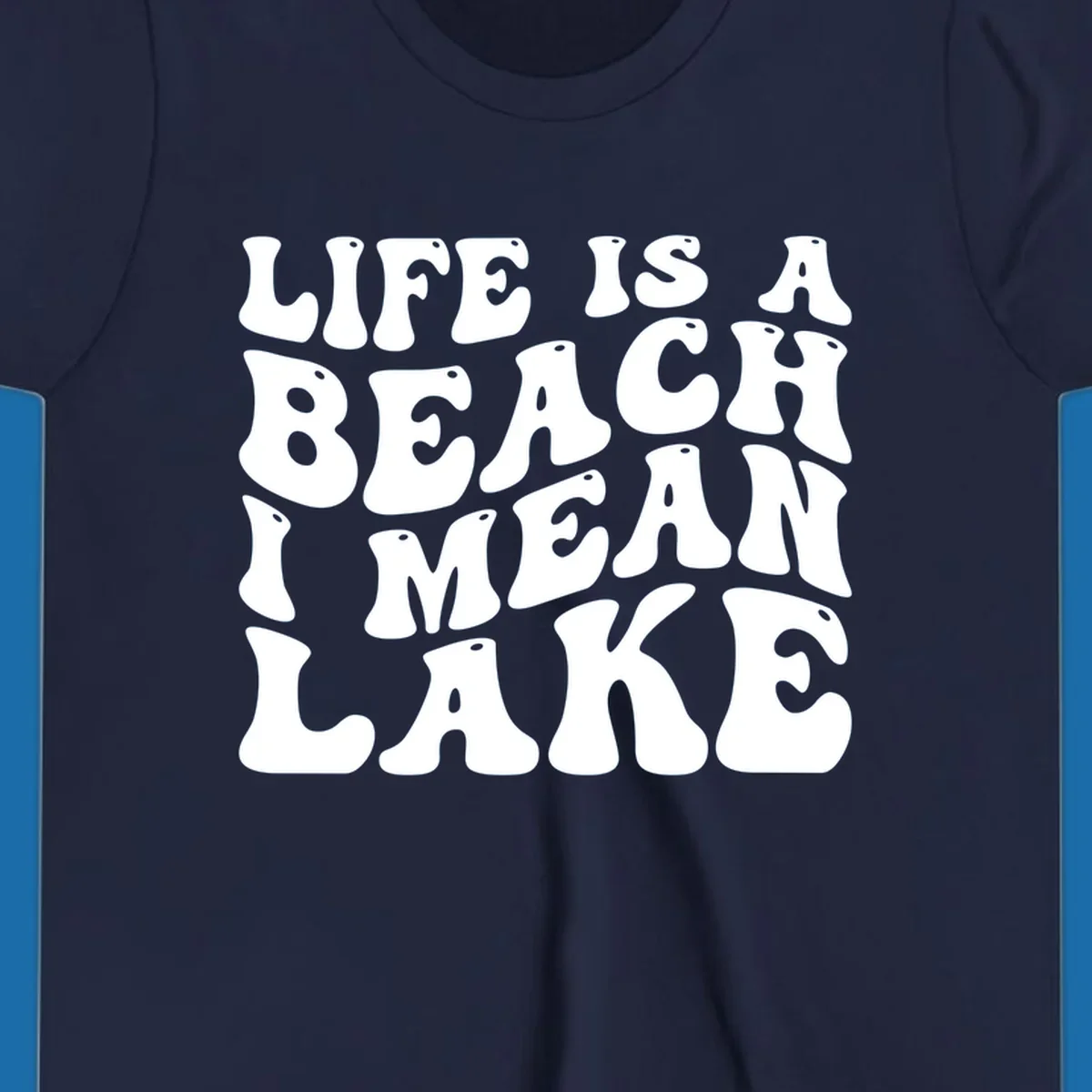 Retro typography design with the phrase "LIFE IS A BEACH I MEAN LAKE" for lake-themed apparel.