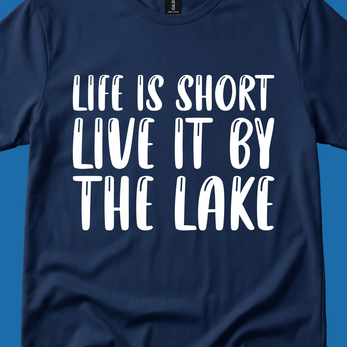 Bold white text "Life Is Short Live It By The Lake" for live-by-the-lake shirt.