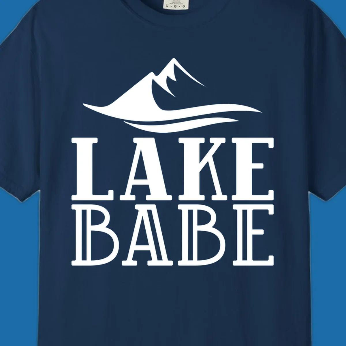 Lake Babe mountain wave graphic design with white text and illustration.