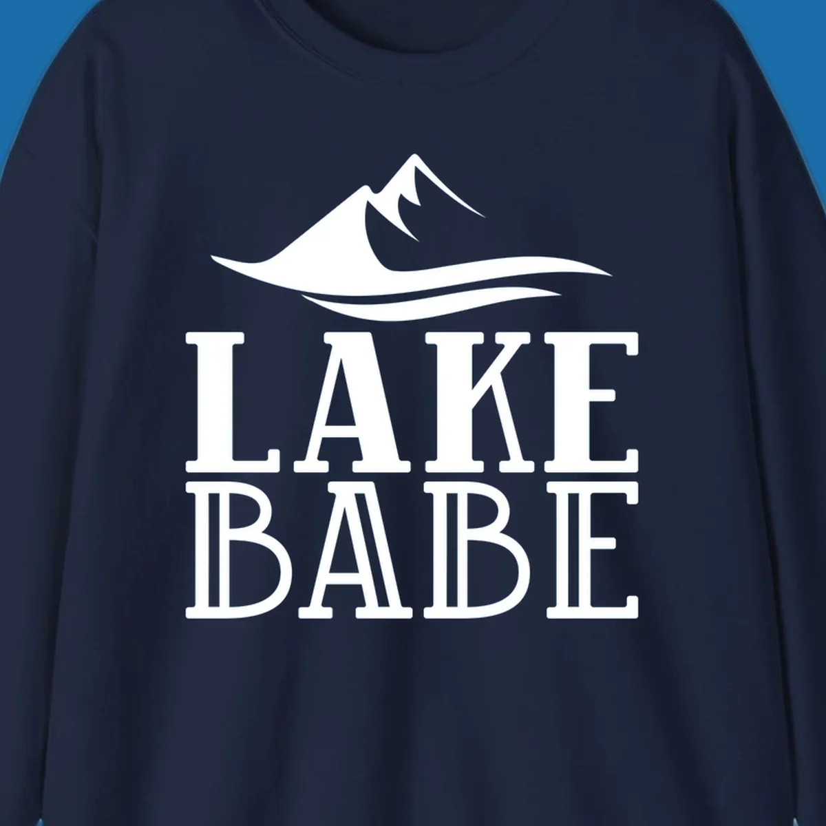 Lake Babe mountain wave graphic design with white text and illustration.