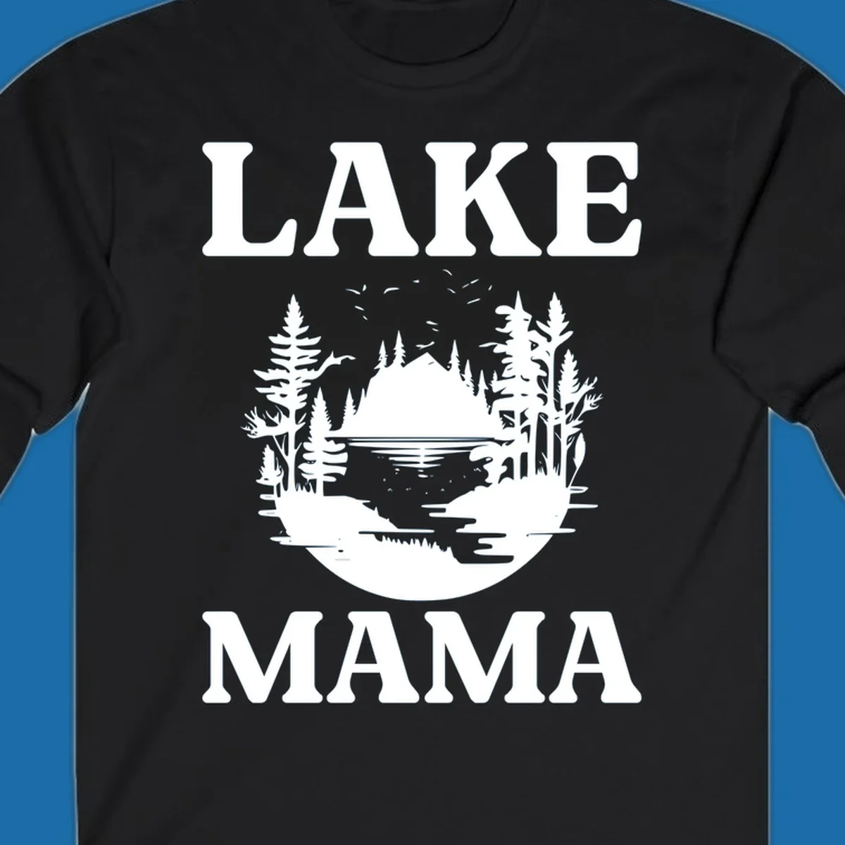 Lake Mama nature scene with trees, lake, and mountains silhouette.