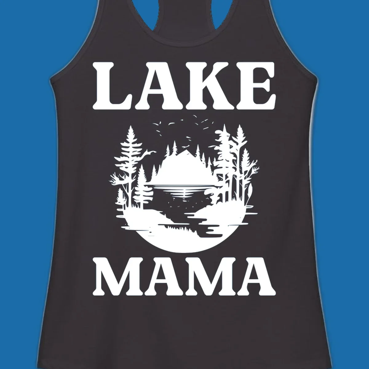 Lake Mama nature scene with trees, lake, and mountains silhouette.