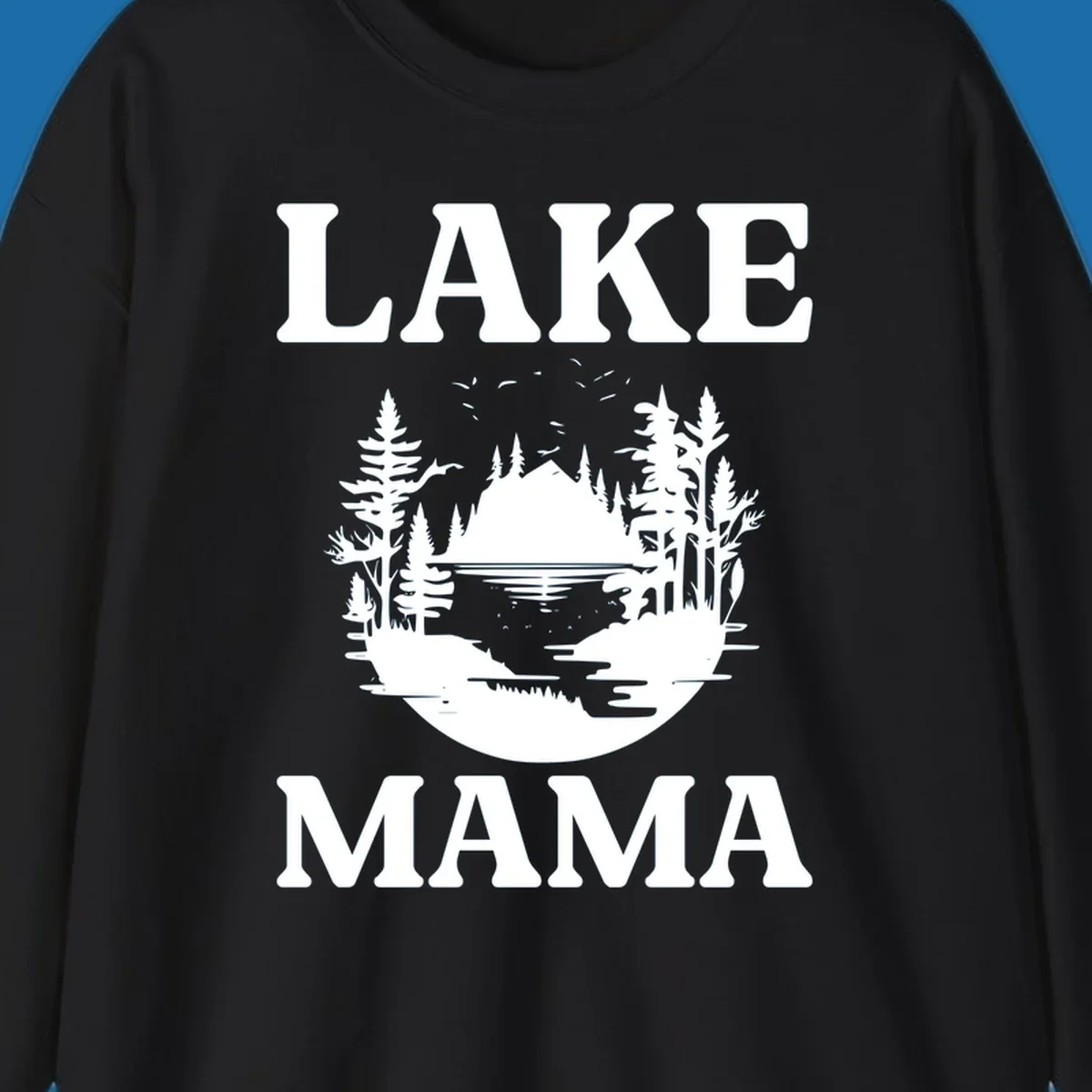 Lake Mama nature scene with trees, lake, and mountains silhouette.