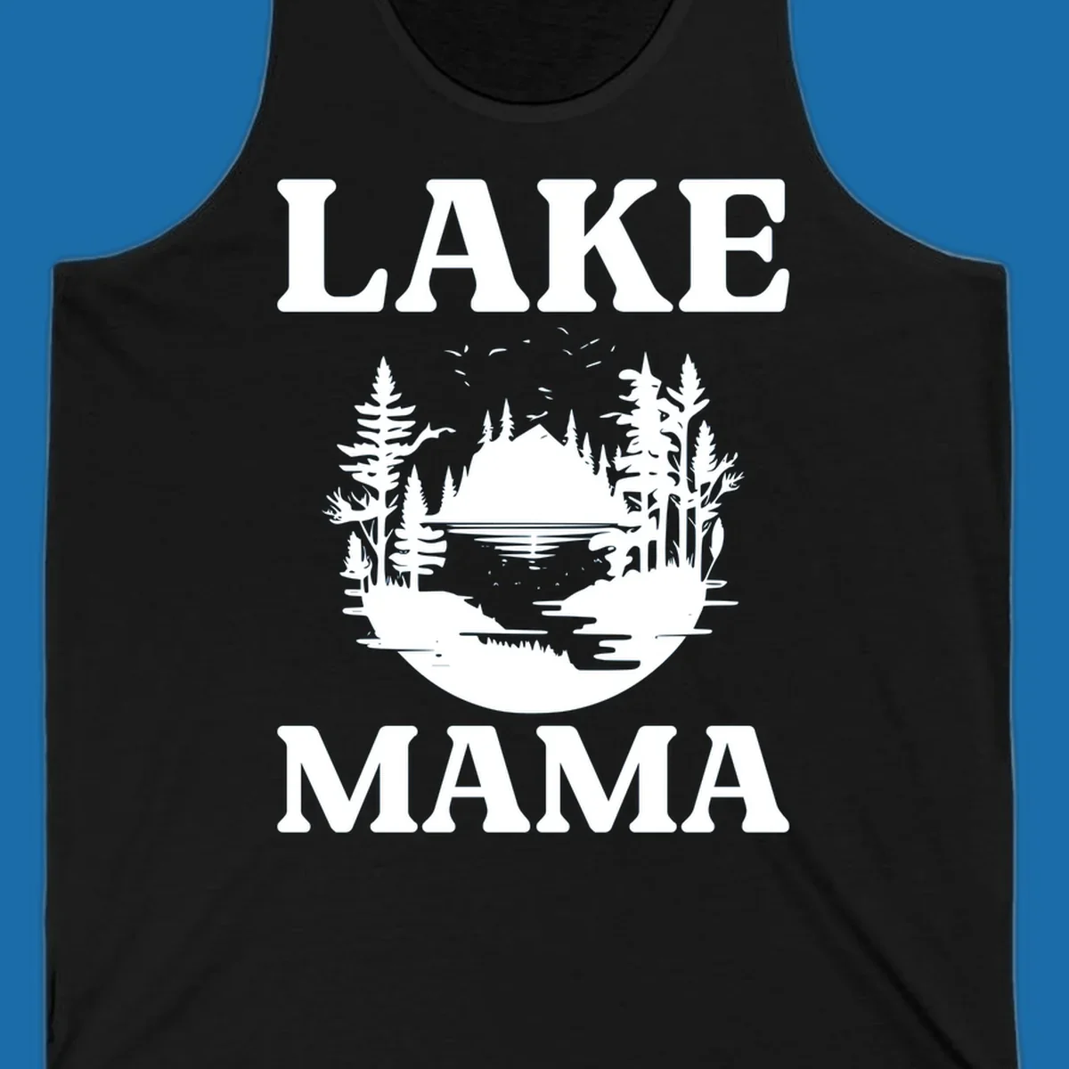 Lake Mama nature scene with trees, lake, and mountains silhouette.